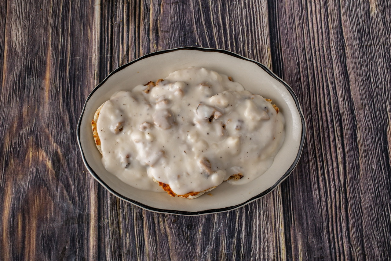 Order Sausage, Biscuit and Gravy food online from House of Pies store, Los Angeles on bringmethat.com