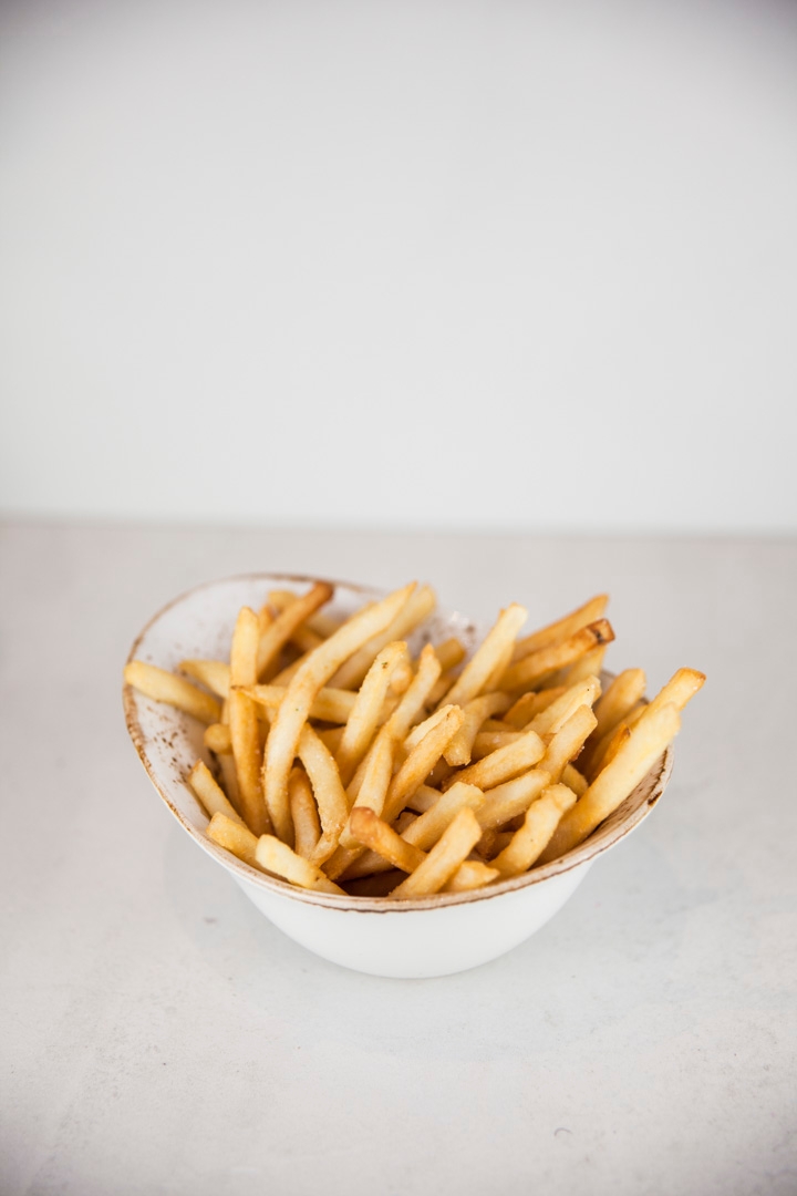 Order French fries food online from Limon Rotisserie store, San Francisco on bringmethat.com