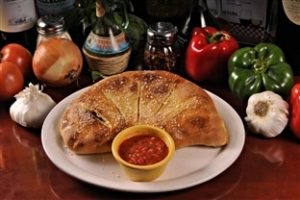 Order Meat Calzone food online from Kelseys Pizza store, Titusville on bringmethat.com