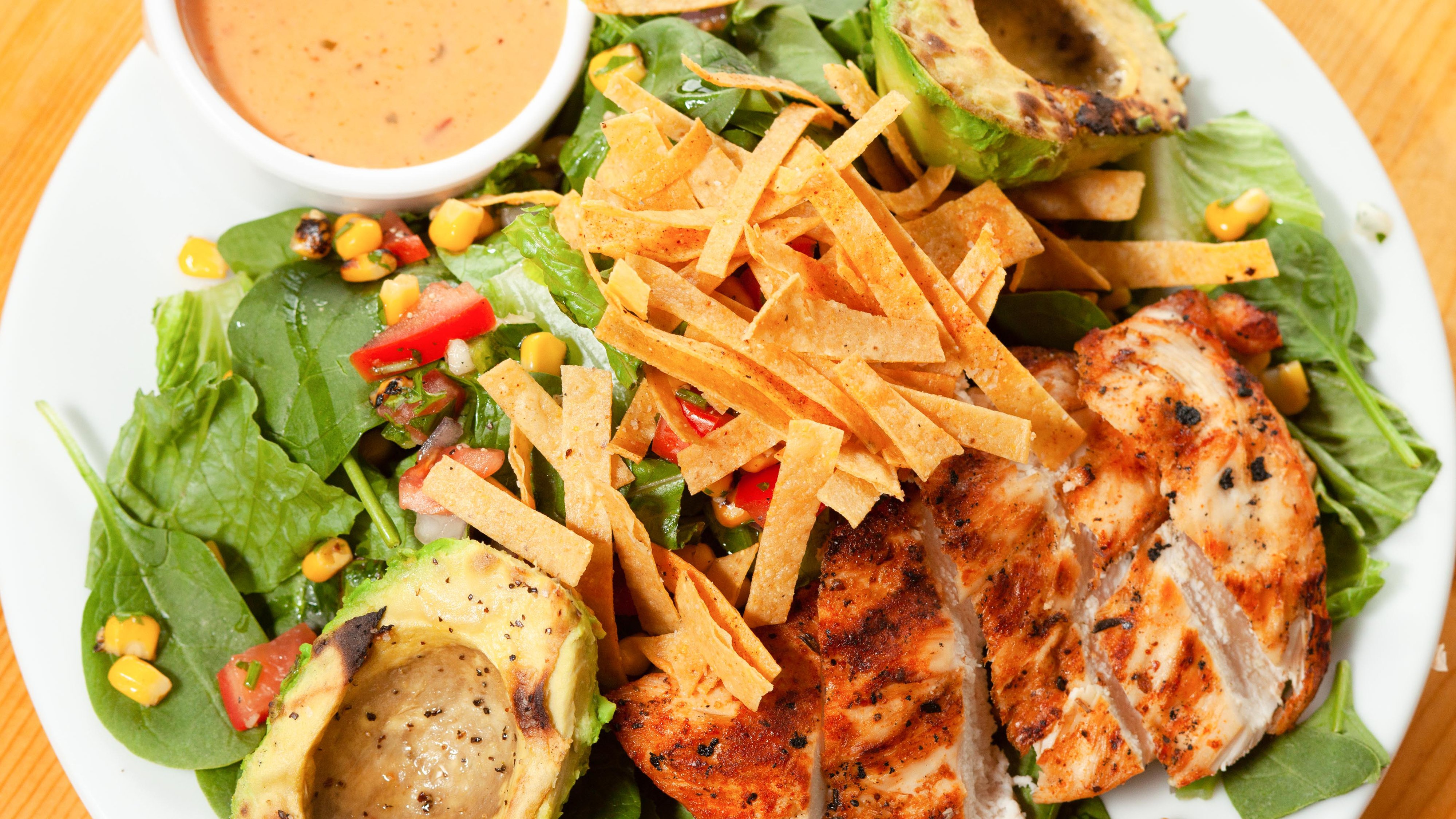 Order Grilled Chicken and Avocado Salad food online from 2 Penguins Tap And Grill store, Centennial on bringmethat.com