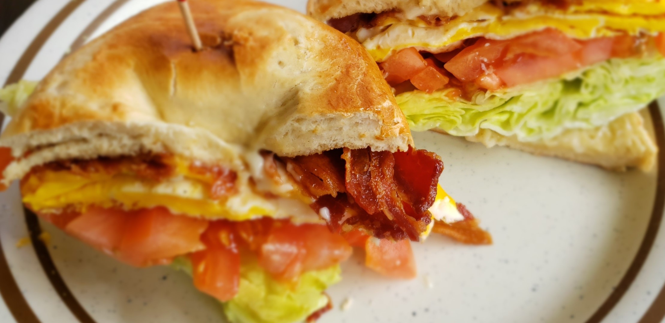 Order 2 Eggs Sandwich with Bacon food online from Breakfast Cafe store, Oak Park on bringmethat.com