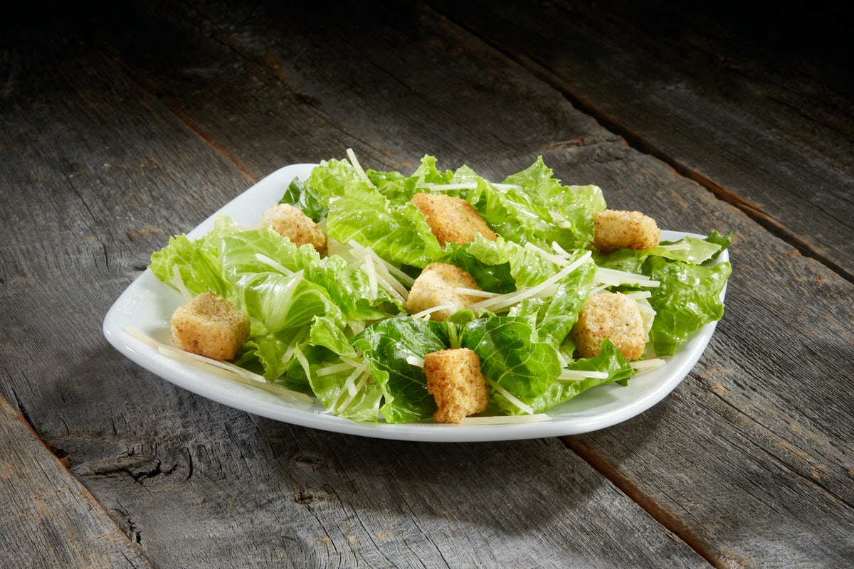Order Caesar Side Salad food online from Sizzler store, Modesto on bringmethat.com