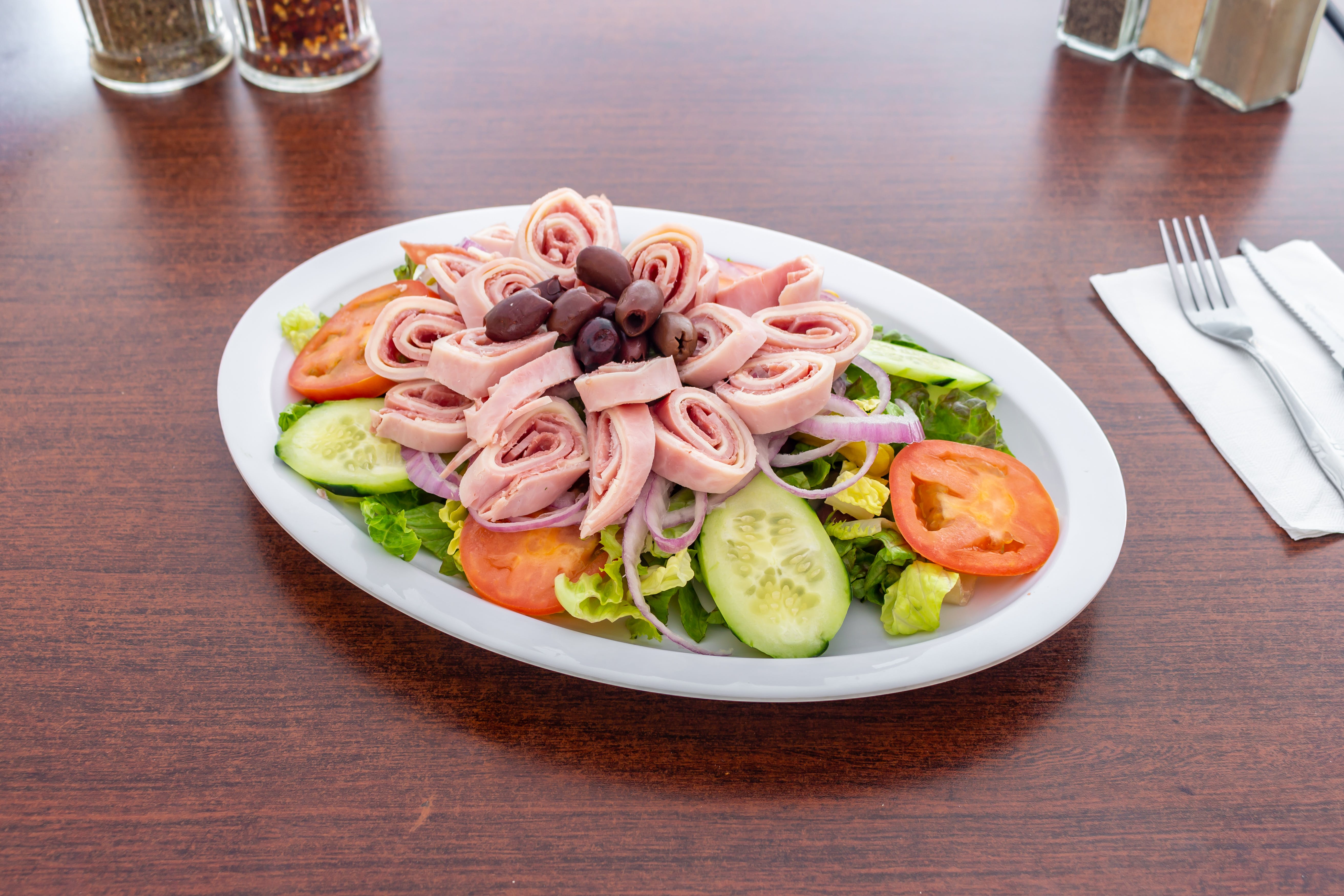 Order Antipasto Salad - Salad food online from Sopranos Pizzeria store, New Milford on bringmethat.com