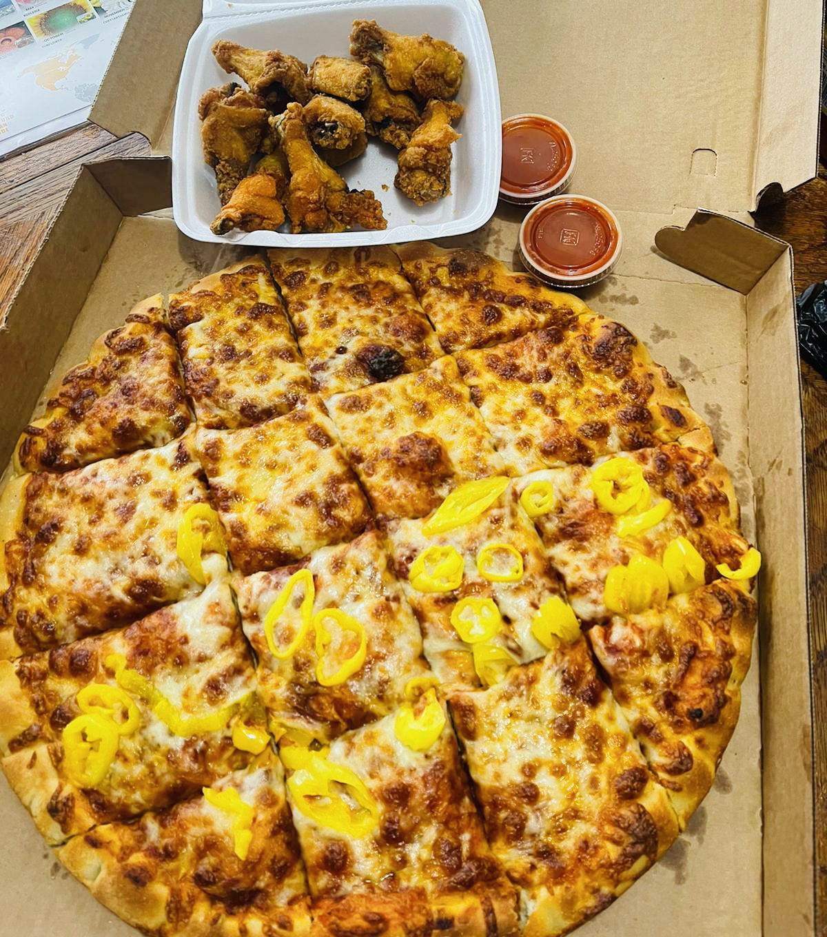 Order Pizza wings combo. Lg.cheese pizza w/15wings.and 2-litter soda. 1-blue cheese 1-boss sauce.  food online from El Deli store, Rochester on bringmethat.com