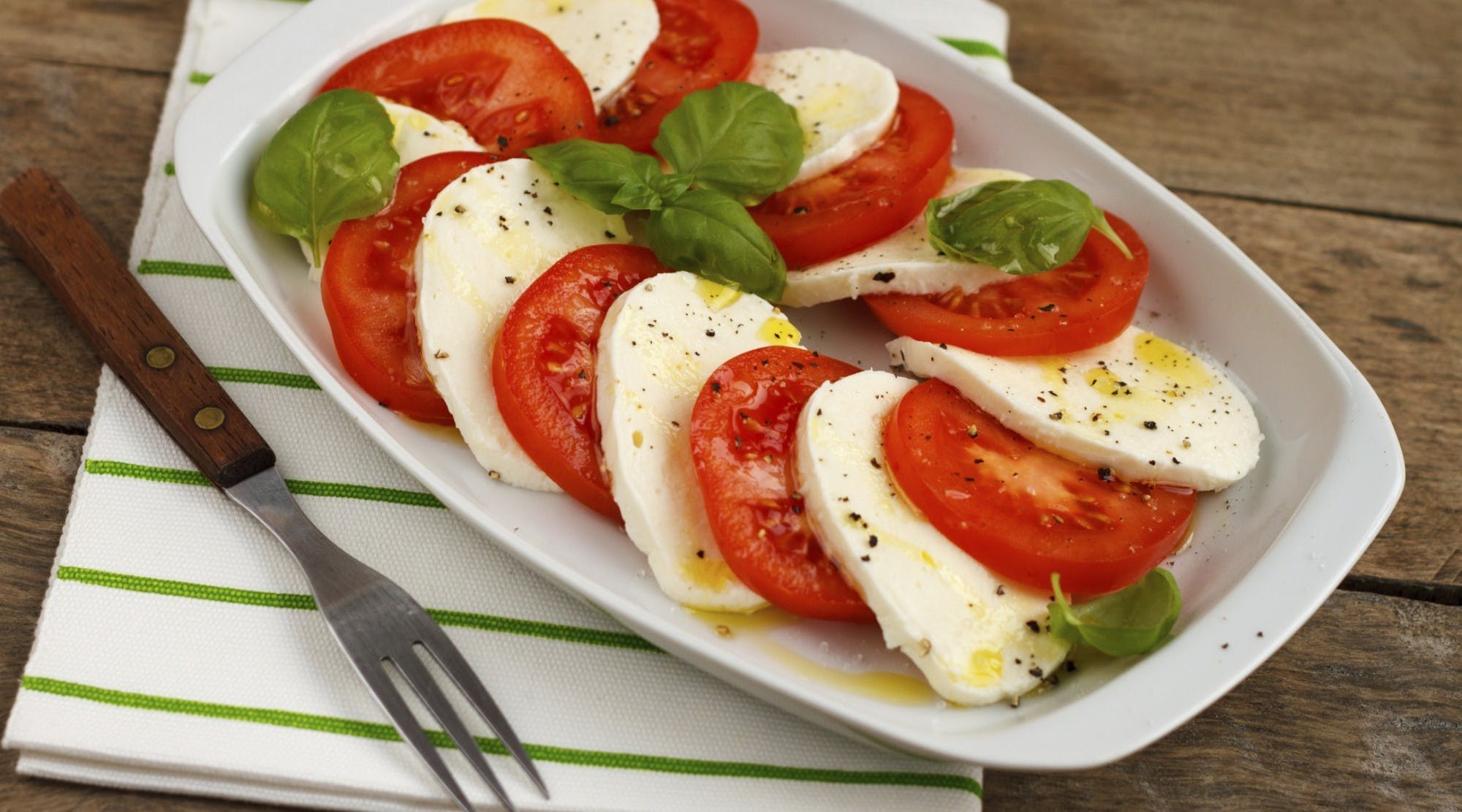 Order Caprese Salad - Salad food online from Deanna Pizza store, New Rochelle on bringmethat.com