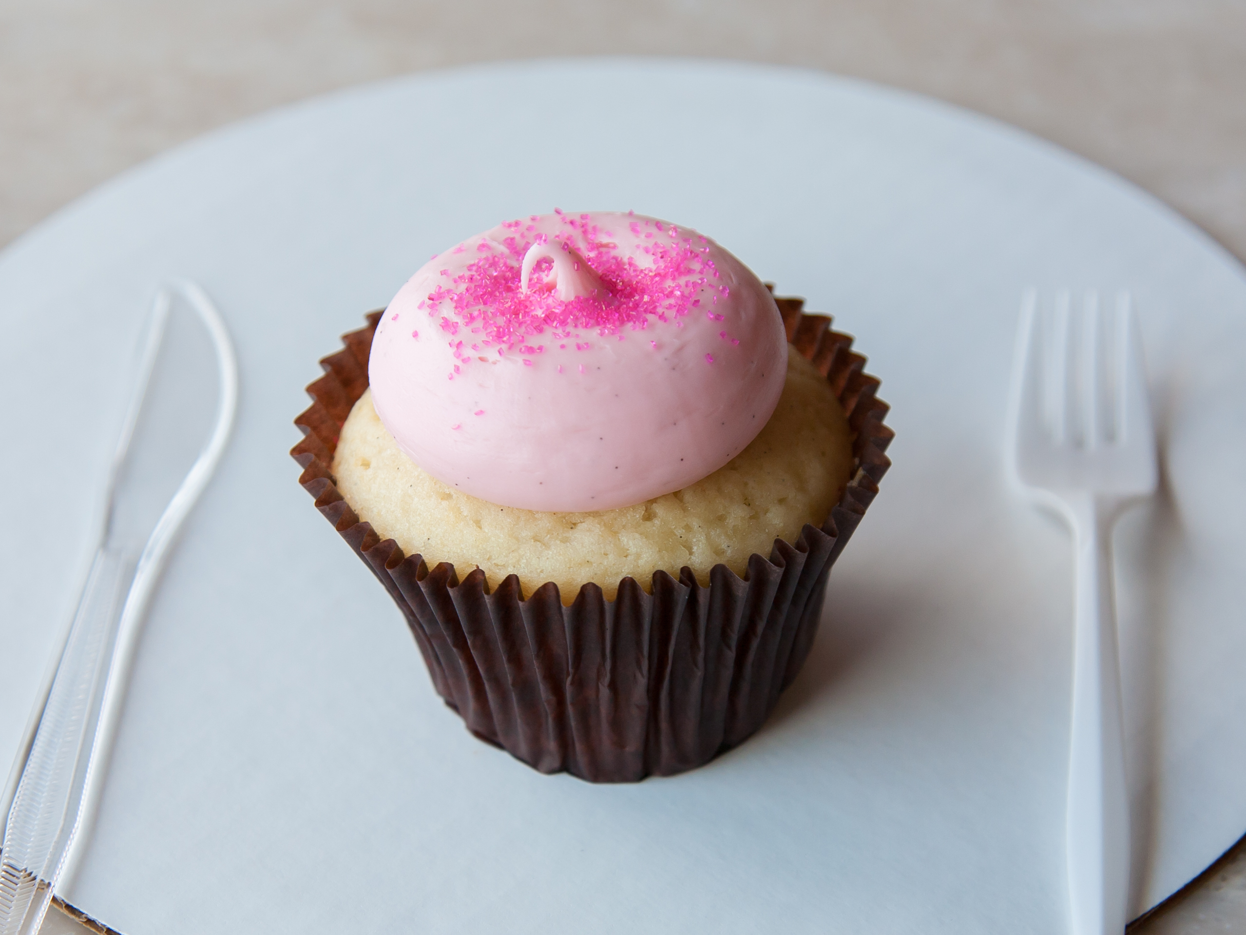 Order Pink Vanilla Cupcake food online from Smallcakes store, Naperville on bringmethat.com