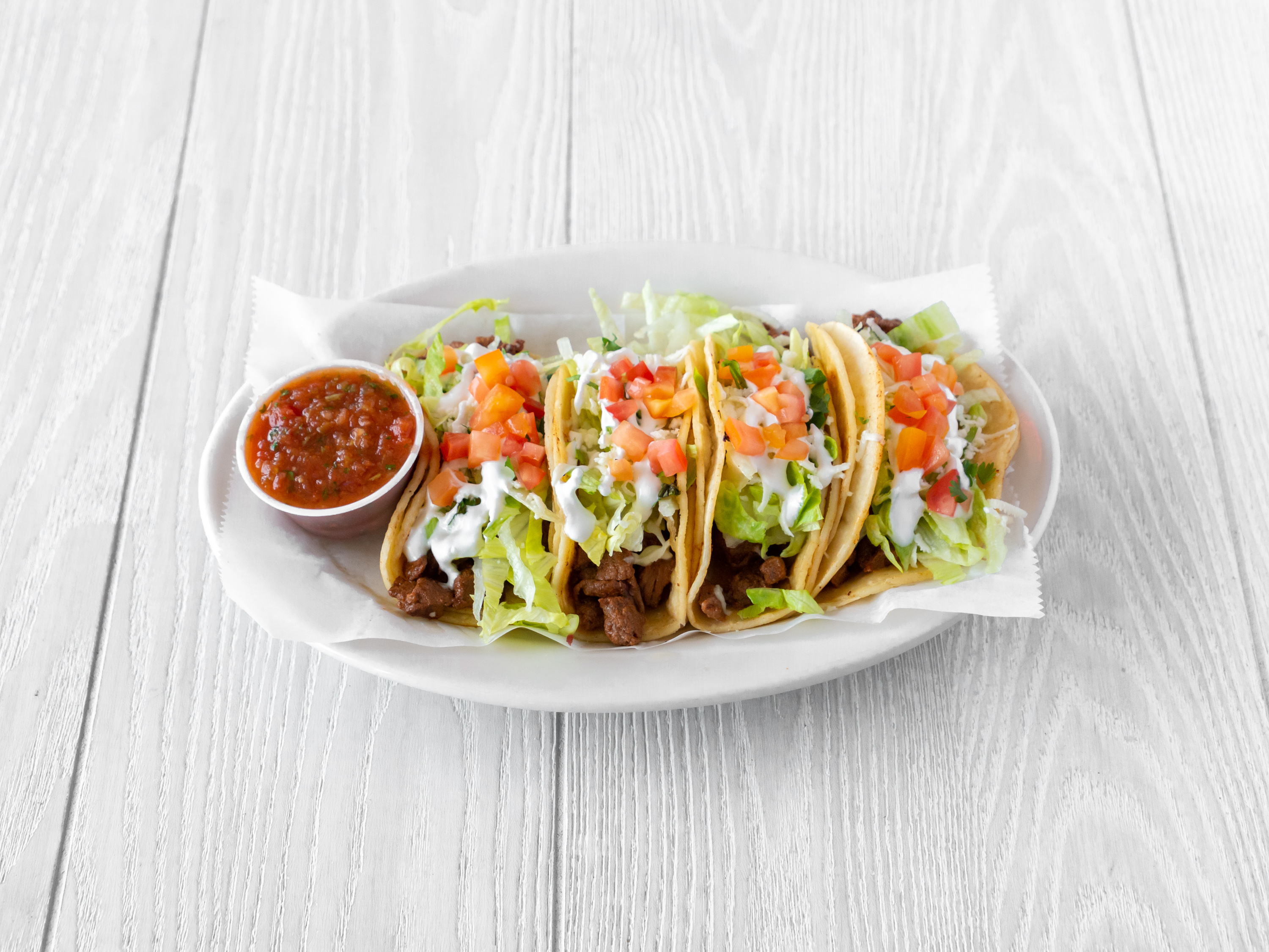 Order Tacos de Carne Asada(4pc) food online from La Cabaña Restaurant store, Wilmington on bringmethat.com