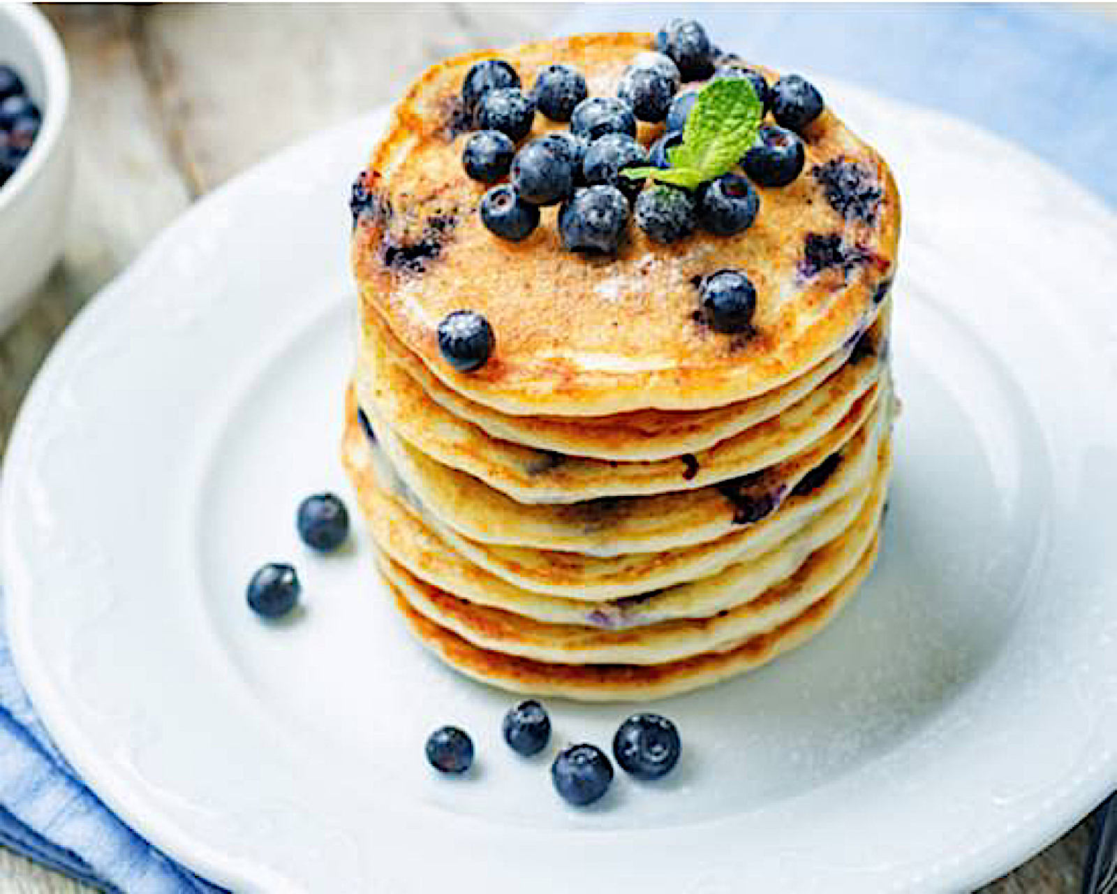 Order  3 Buttermilk Pancakes with fresh blueberries food online from 5 brothers gourmet deli store, New York on bringmethat.com