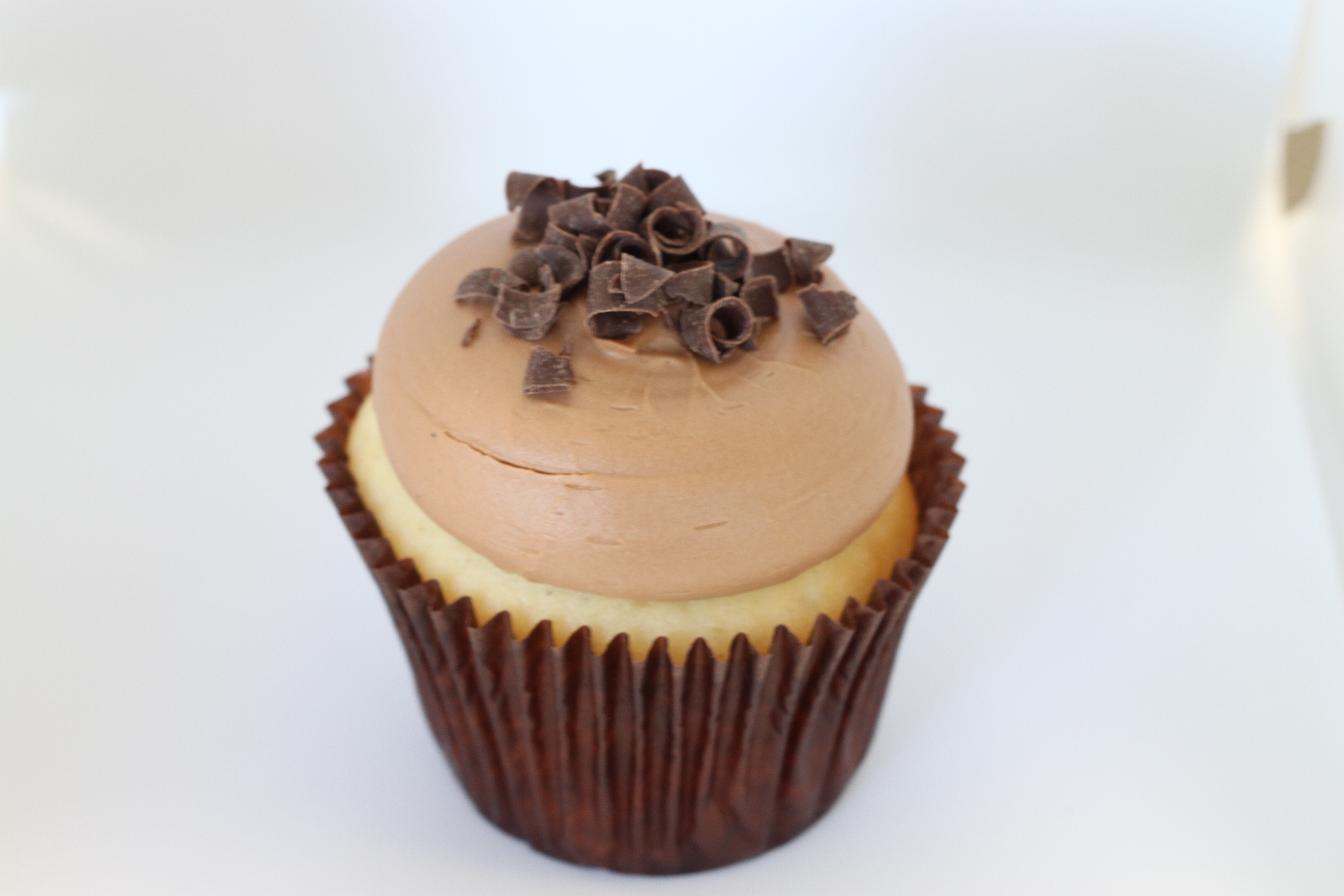 Order Vanilla and Chocolate Cupcake food online from Smallcakes Cupcakery And Creamery store, Garhanna on bringmethat.com