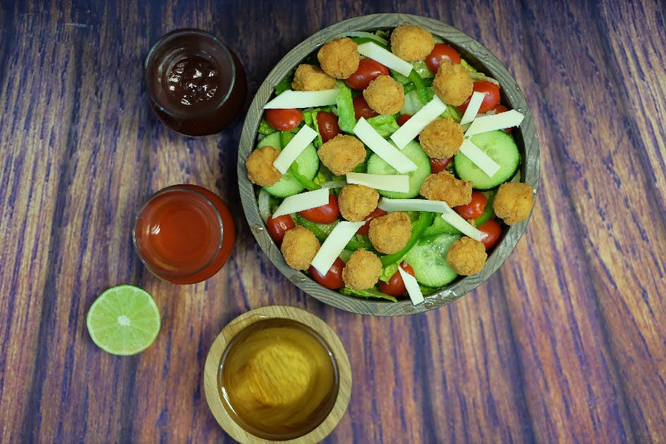Order Popcorn Chicken Salad - Salad food online from Oscar's Pizza store, Colonie on bringmethat.com