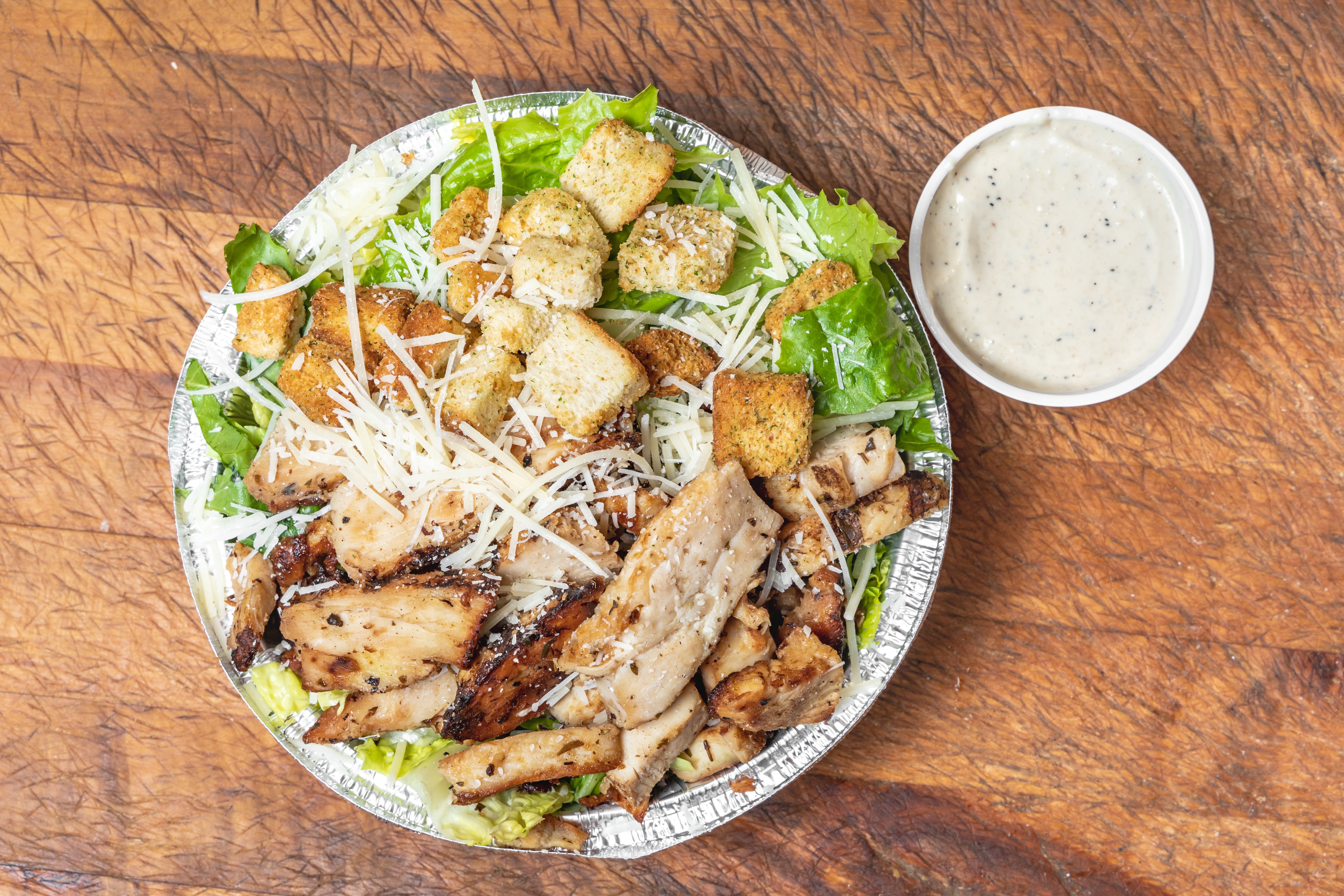 Order Caesar Salad with Chicken - Salad food online from Garden Pizza store, Milford on bringmethat.com