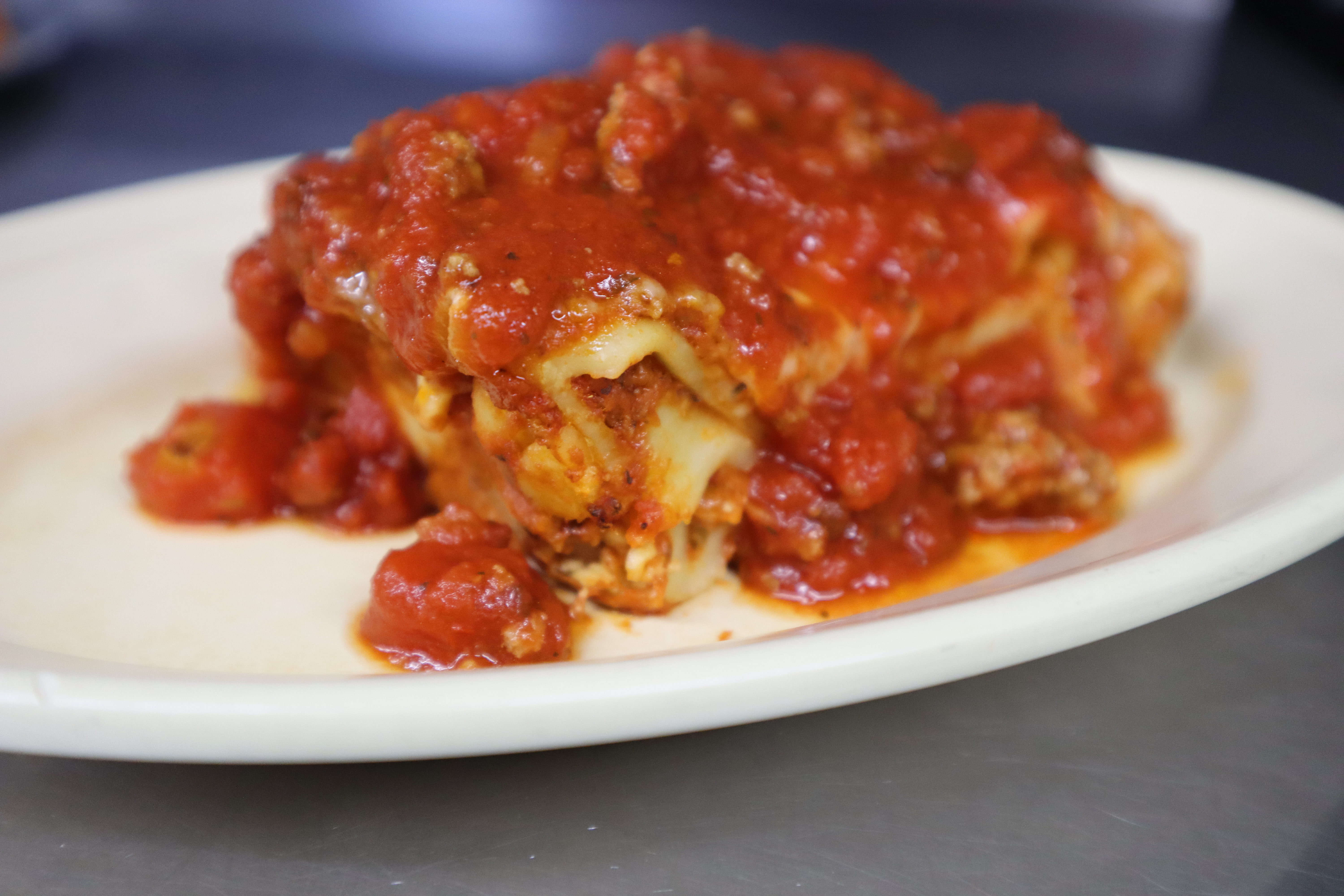 Order Meat lasagna  food online from Angilo's Pizza store, Louisville on bringmethat.com