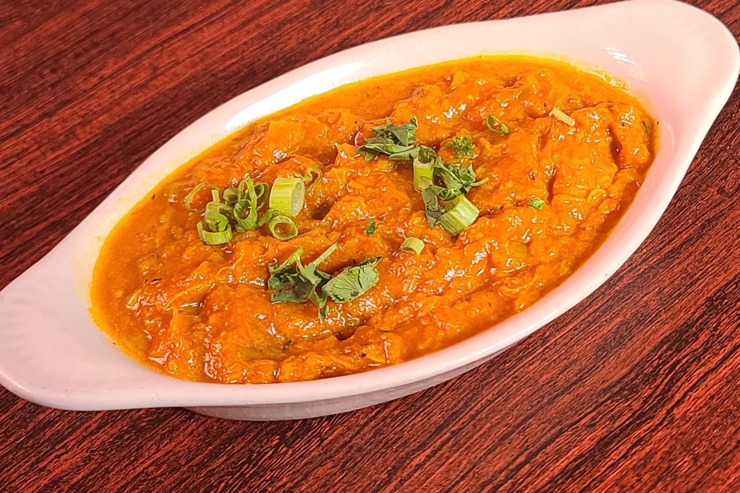 Order Baigan Bharta food online from Om Indian Cuisine store, San Francisco on bringmethat.com