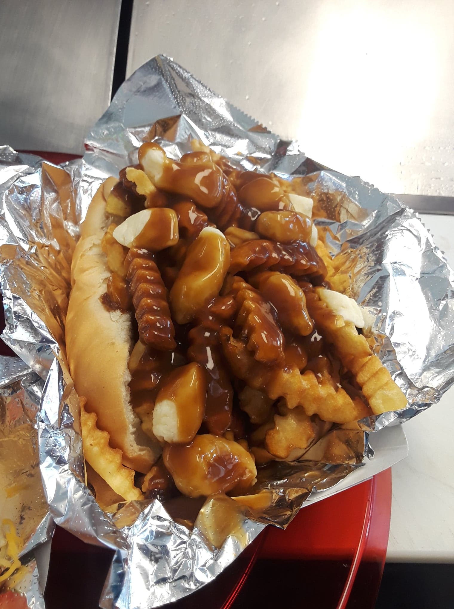 Order Poutine Weenie  food online from Dogmahal Doghaus store, Grand Forks on bringmethat.com