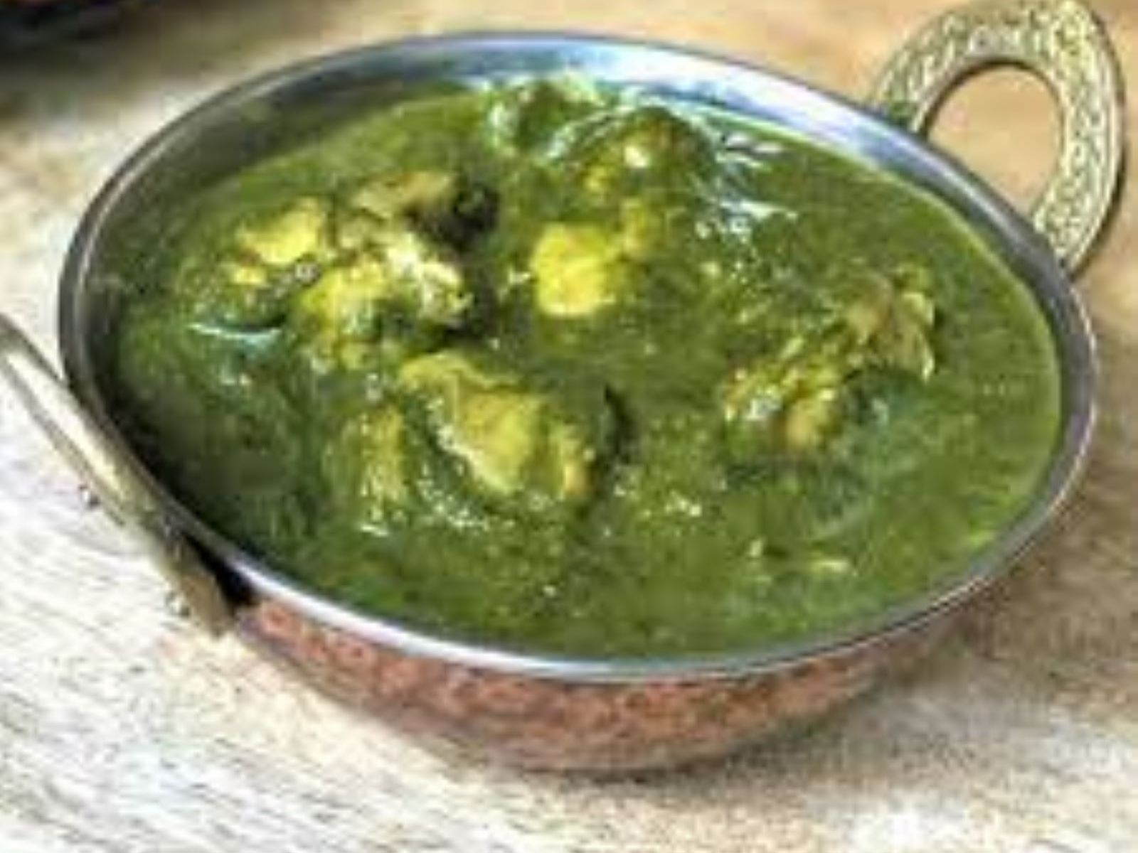 Order Chicken Saag food online from Passage to India store, Cambridge on bringmethat.com