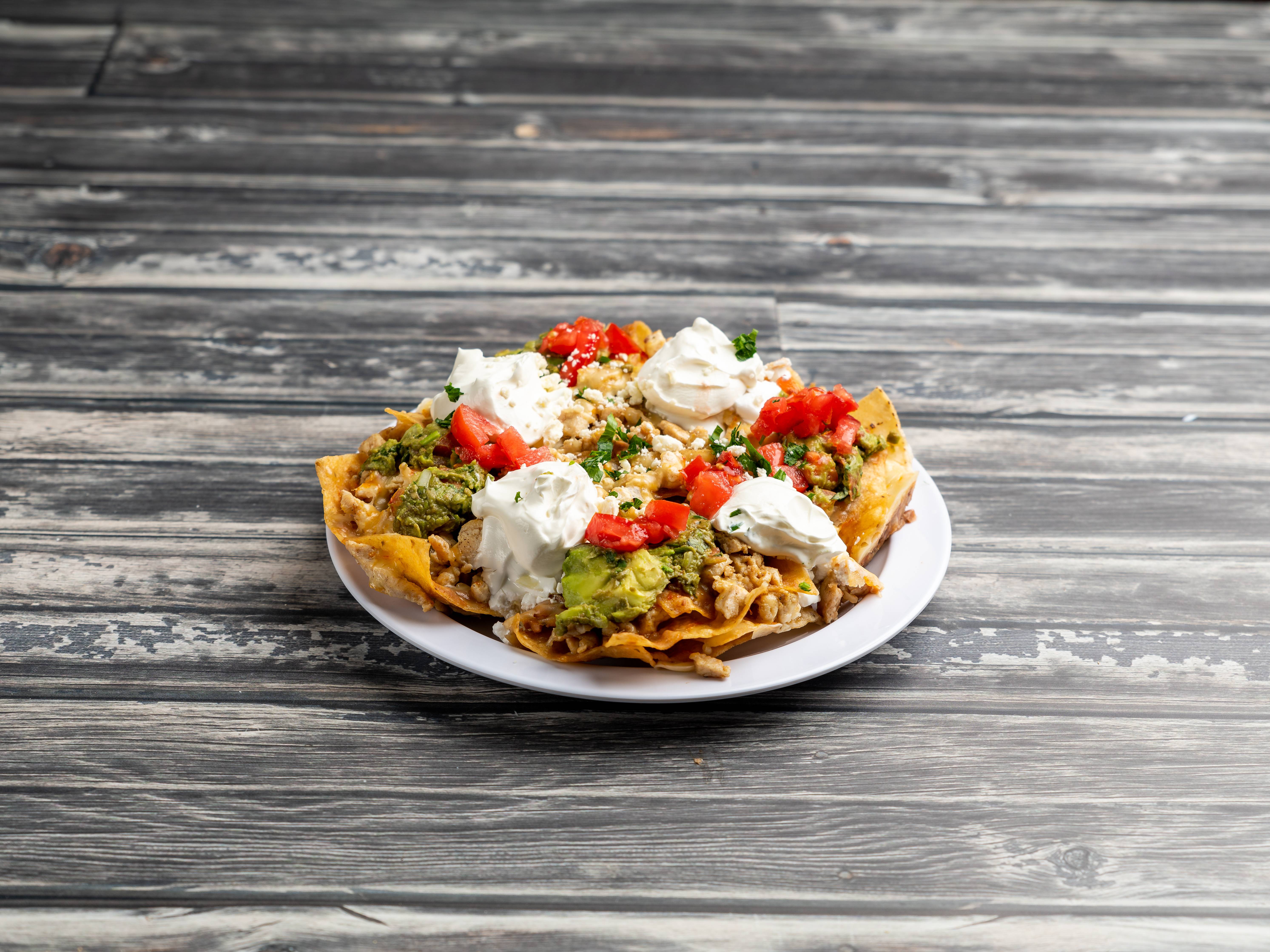 Order Nachos with Meat food online from Taqueria La Fogata store, Chicago on bringmethat.com
