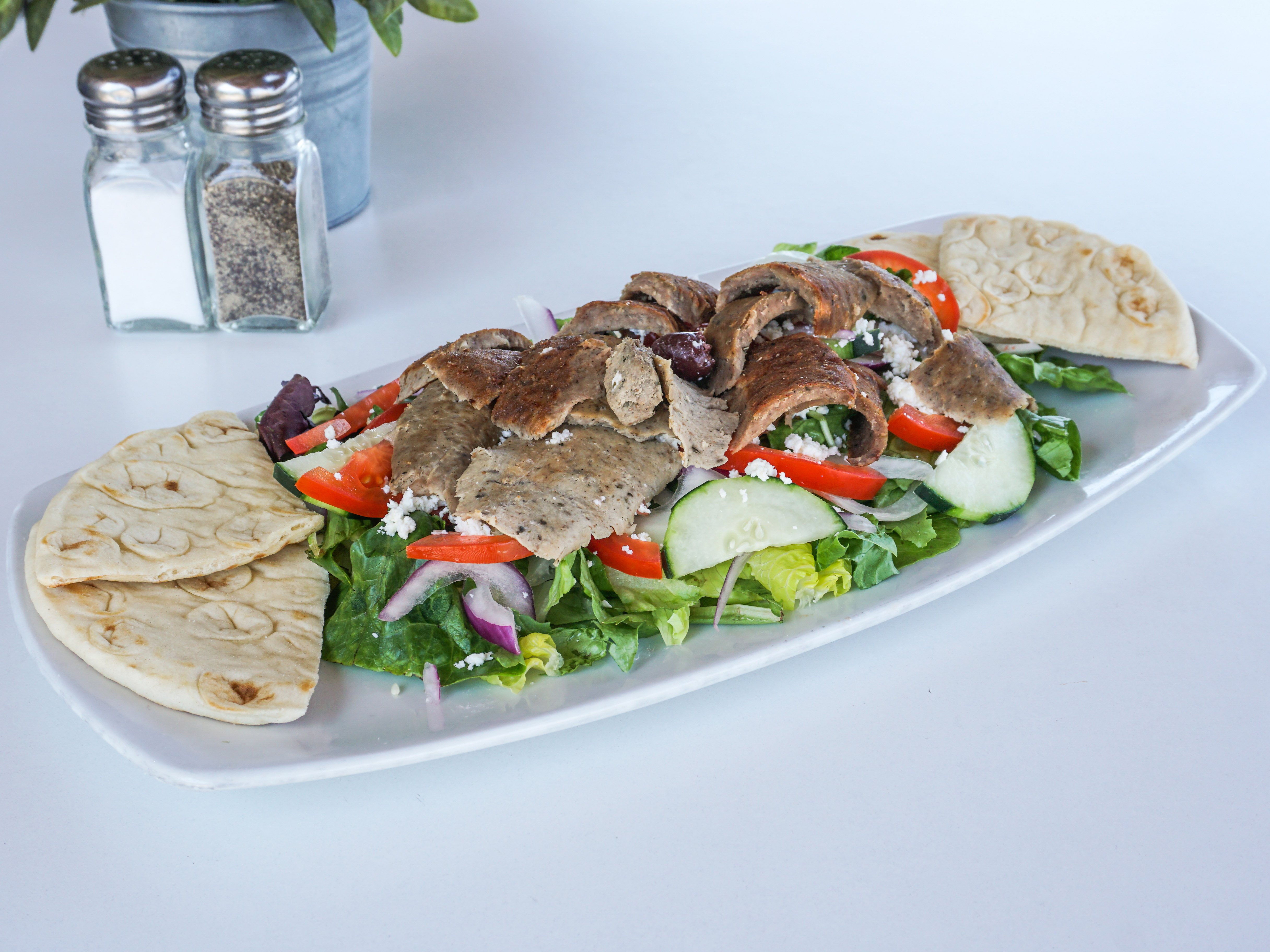 Order Topped with Gyros Meat food online from Santorini Island Grill store, San Diego on bringmethat.com