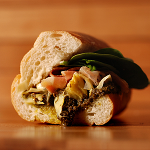 Order #8. Basil Pesto, Prosciutto and Artichoke Hearts food online from Pane Pane Sandwiches store, Seattle on bringmethat.com