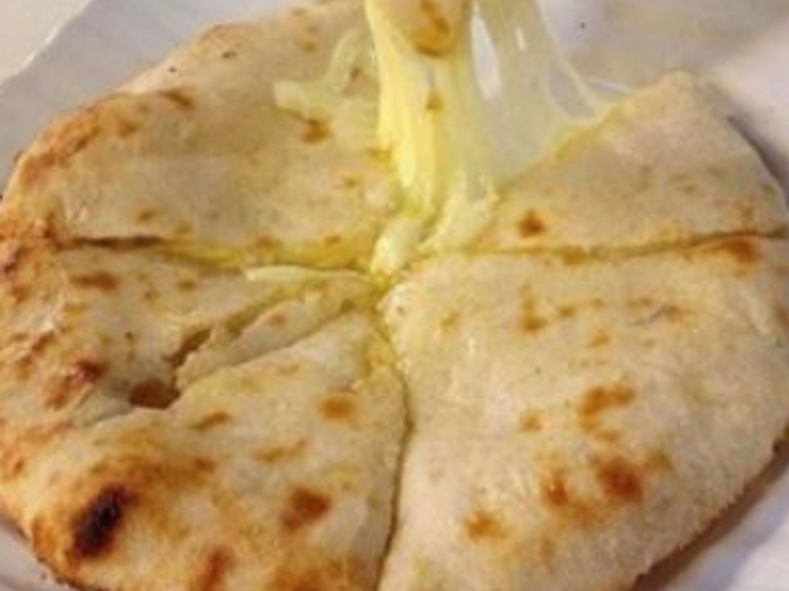 Order Cheese Naan food online from Curry Home store, Pittsburgh on bringmethat.com