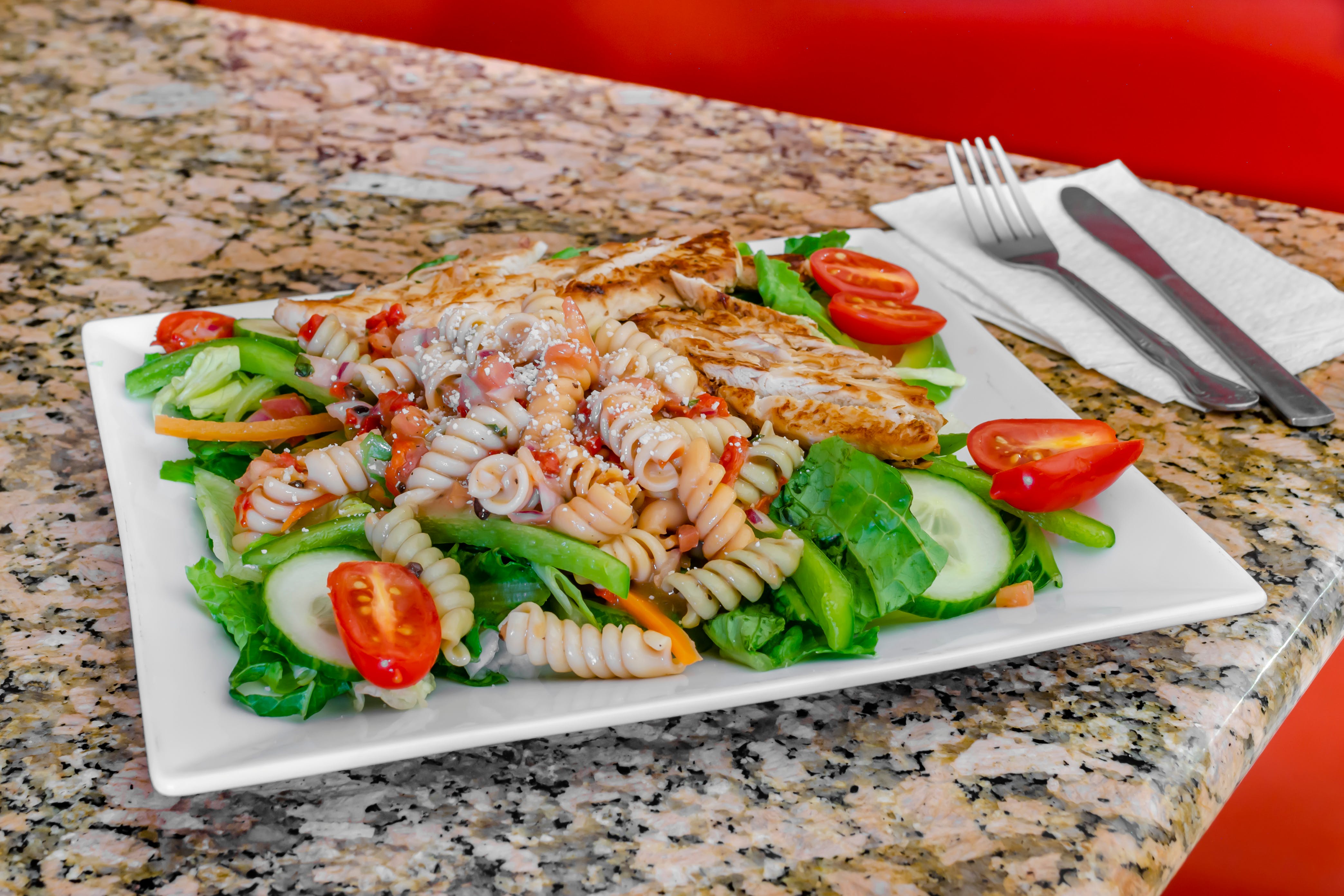 Order Grilled Chicken & Pasta Salad - Large food online from Camila's Pizzeria store, Bensalem on bringmethat.com