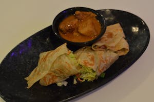 Order A 7. Roti Wrap food online from House Malaysian store, Cliffside on bringmethat.com