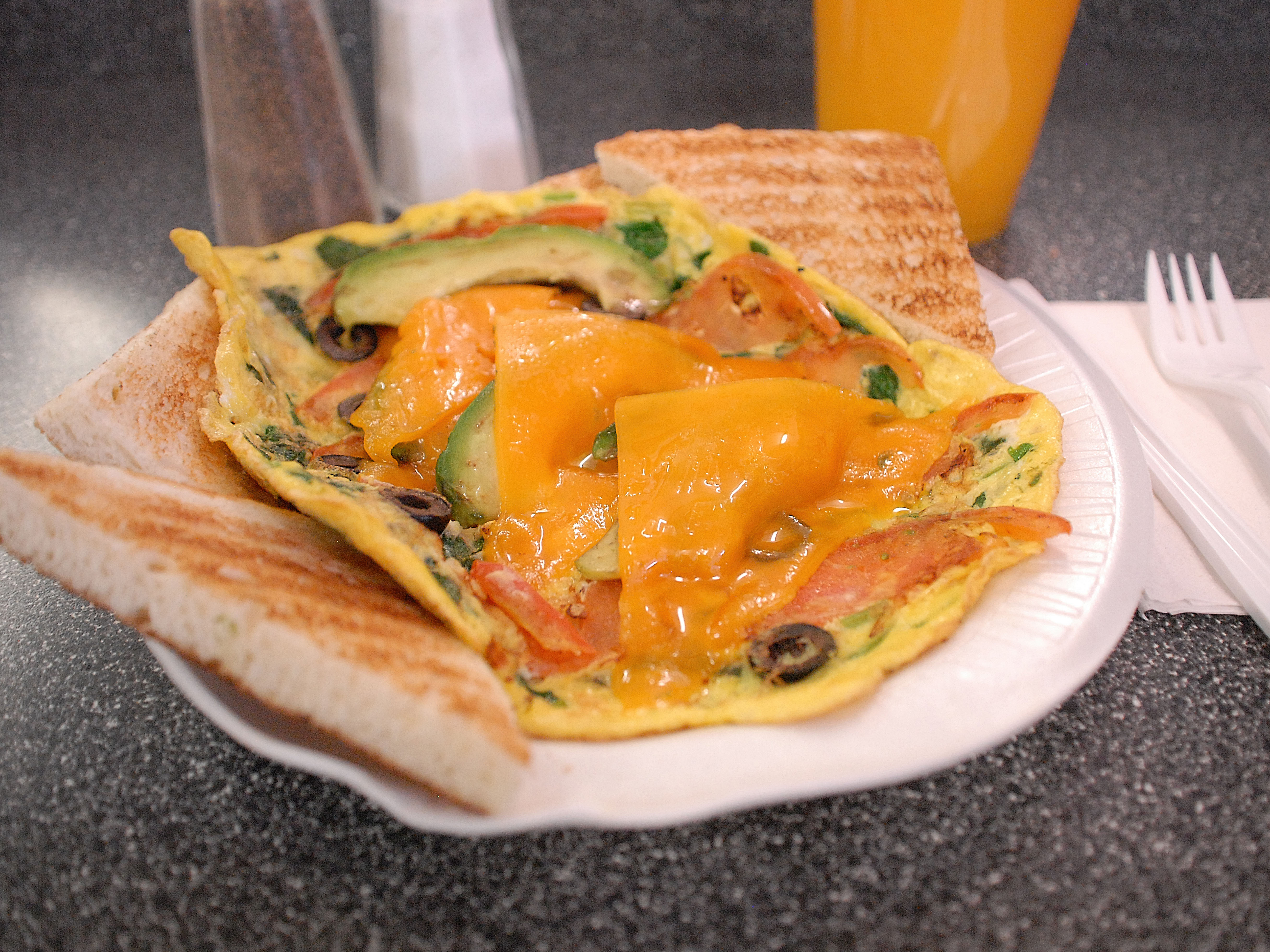 Order 13. Avocado Omelet and a Bagel with Butter food online from New York Bagel Cafe & Deli store, Haledon on bringmethat.com