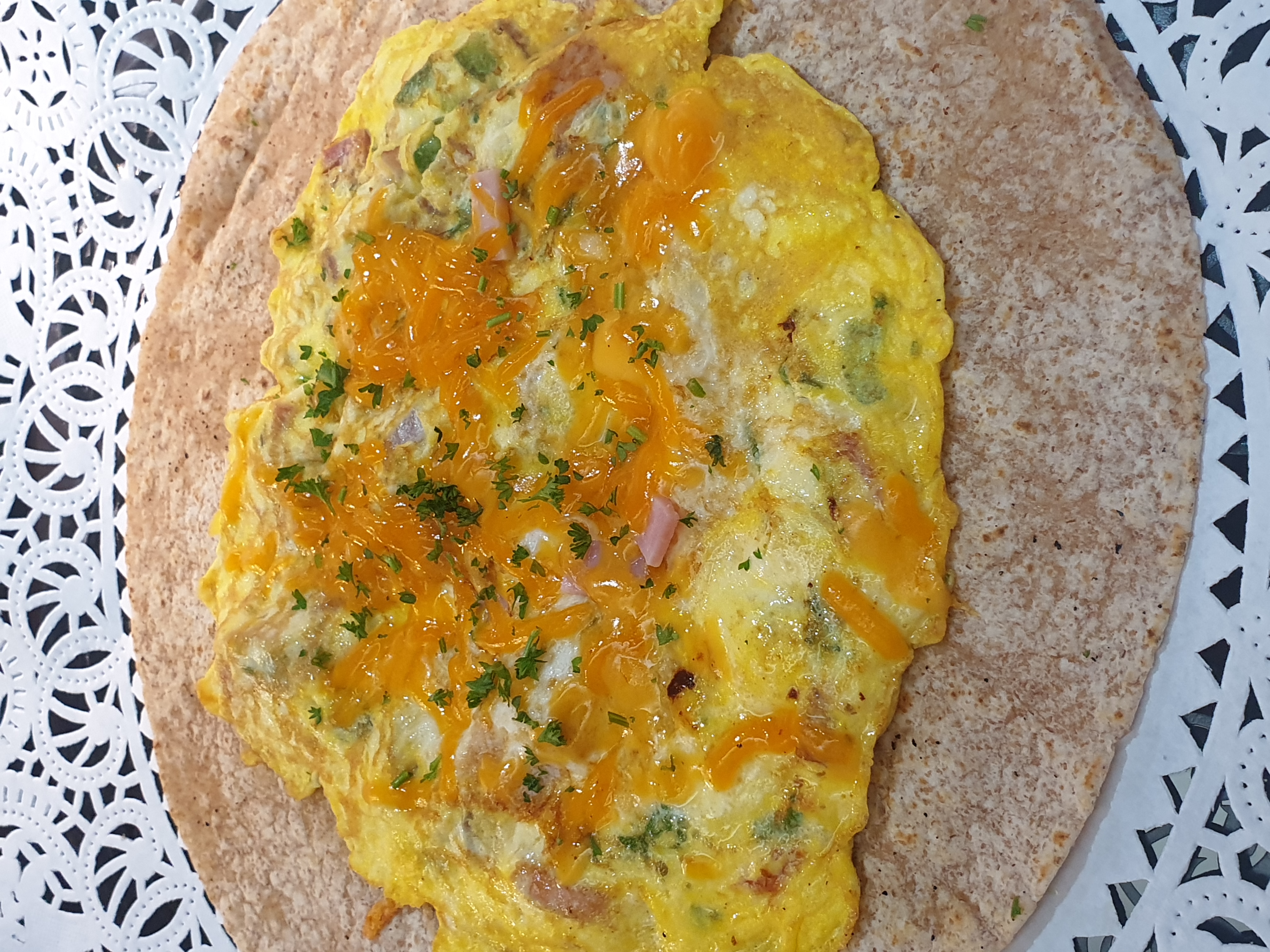 Order 7B- 3 Egg Western Omelette and Cheese in a Wheat Wrap food online from Taz Cafe store, New York on bringmethat.com
