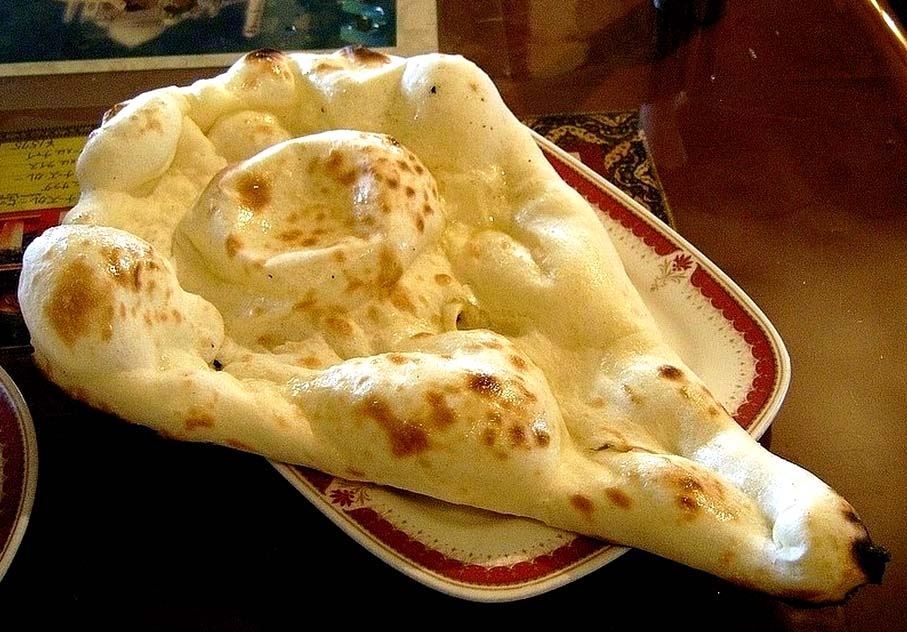 Order Classic Plain Naan food online from Madras Cafe store, San Diego on bringmethat.com