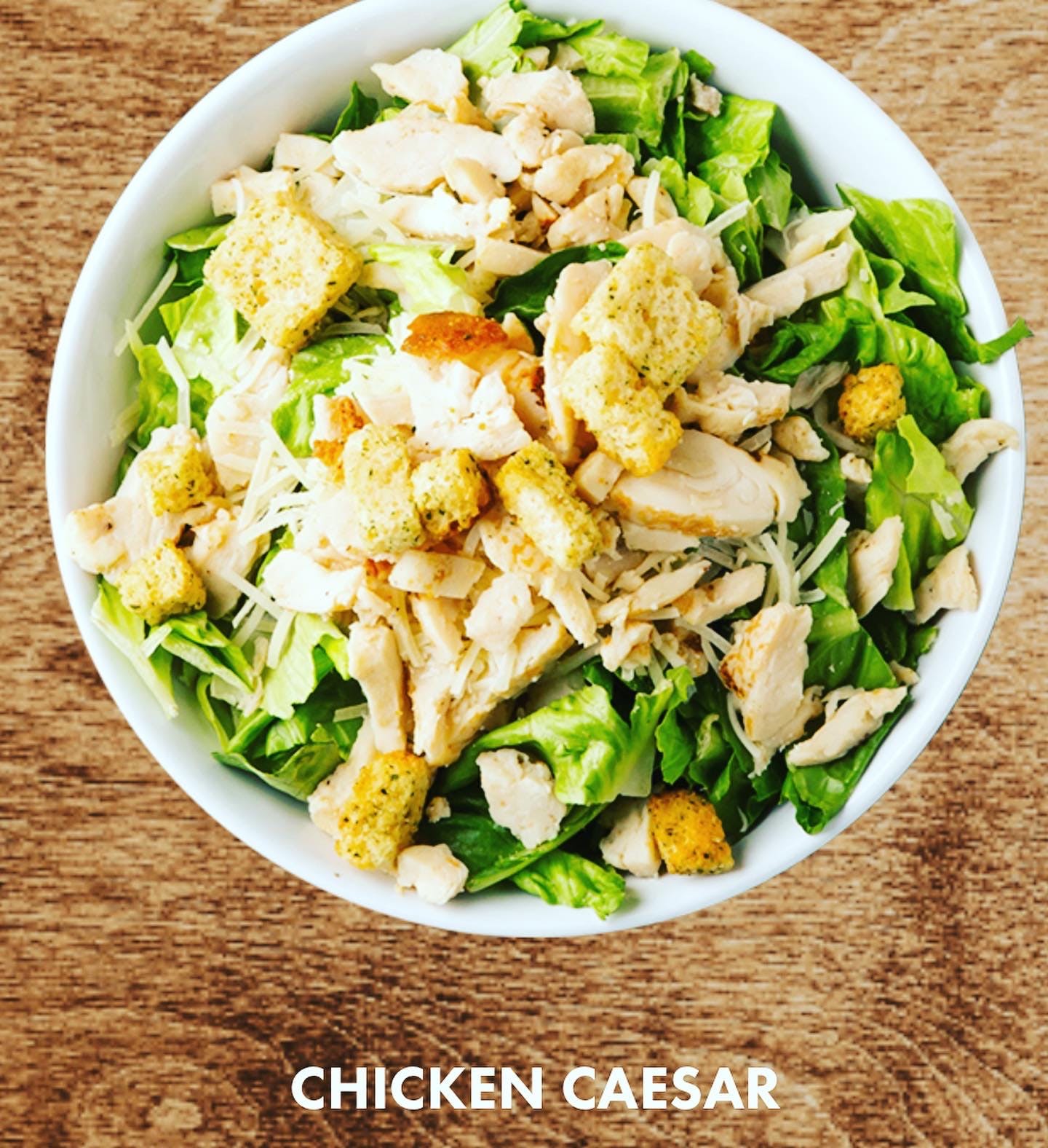 Order Chicken Caesar Salad - Large food online from BARIS Bakery store, Pflugerville on bringmethat.com
