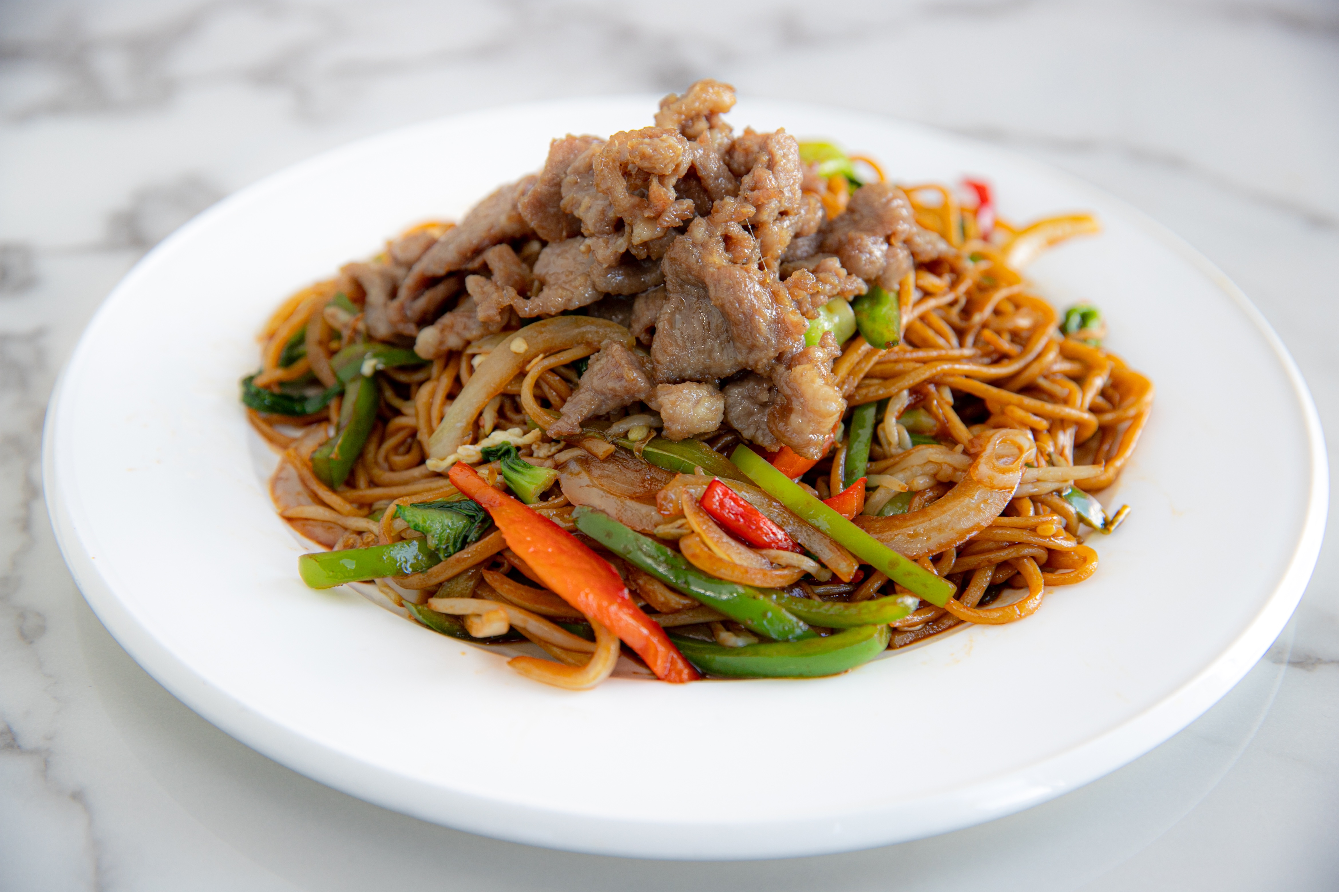 Order N11. Fried Noodles with Cumin Lamb food online from Dun Huang store, Irvine on bringmethat.com