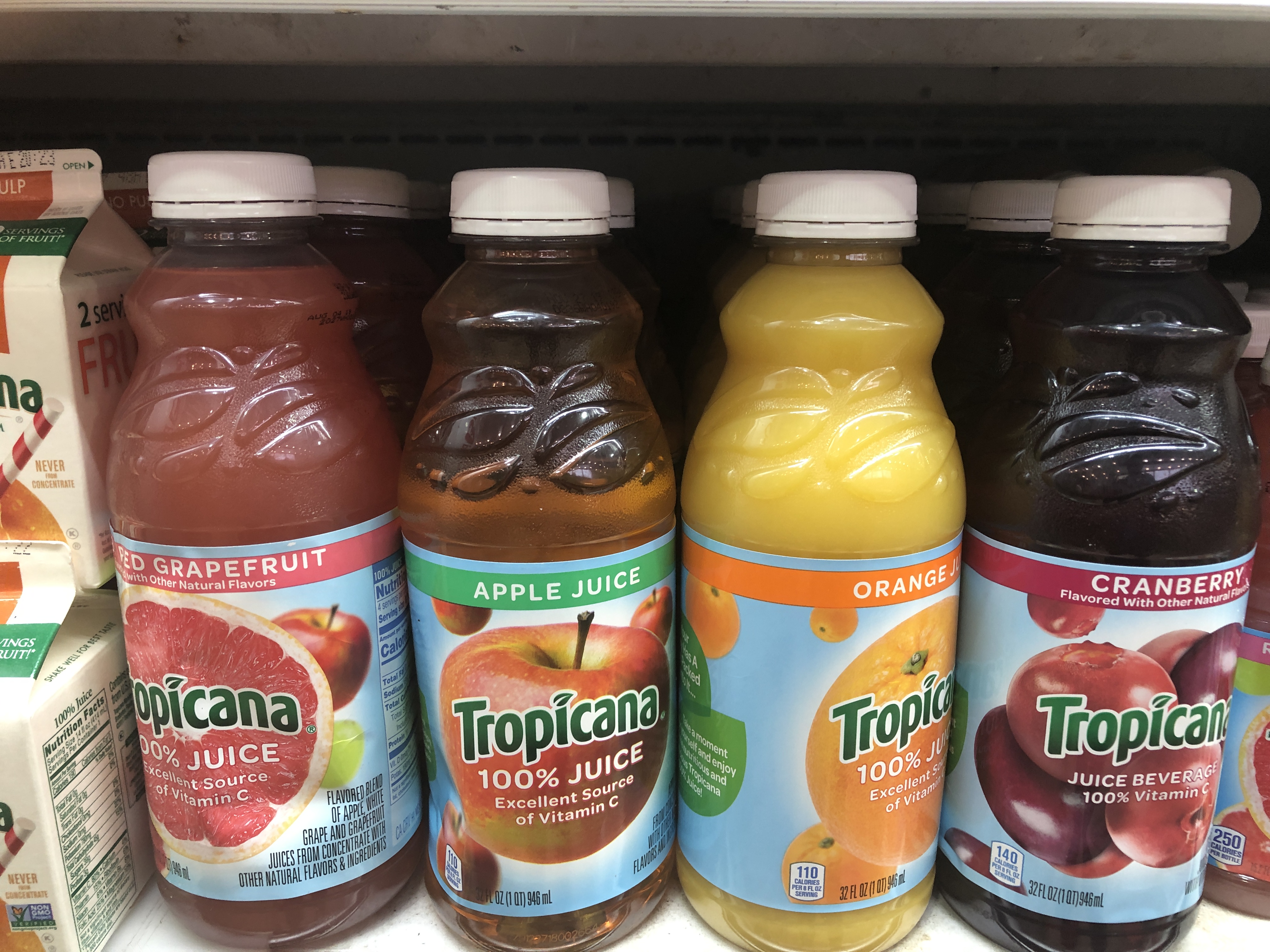 Order 32 oz. Tropicana Juice food online from 5 brothers gourmet deli store, New York on bringmethat.com