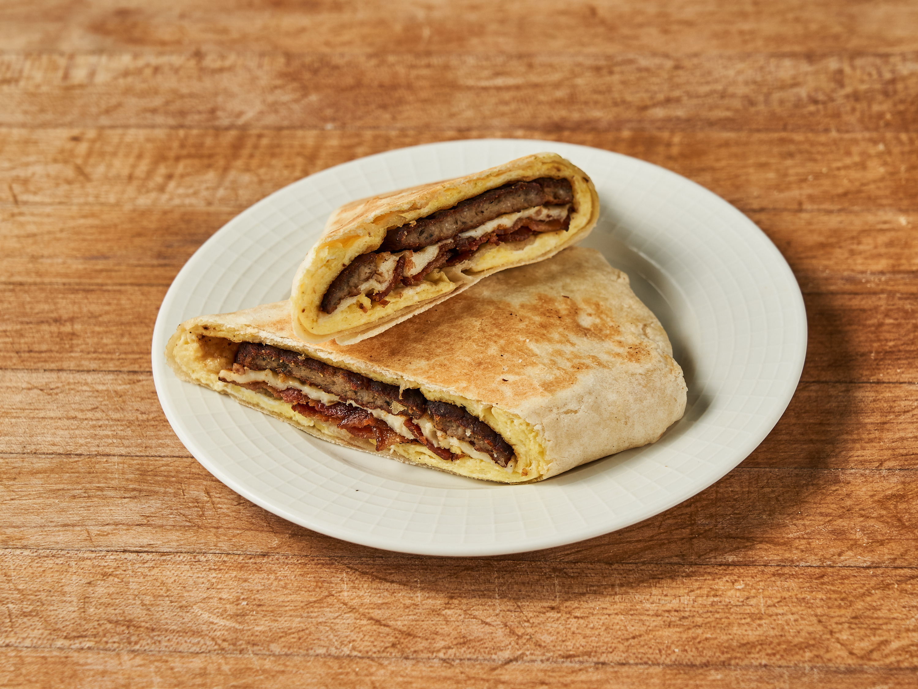 Order Sausage, Egg and Shredded Cheese Wrap food online from La Gran Via Bakery store, Brooklyn on bringmethat.com