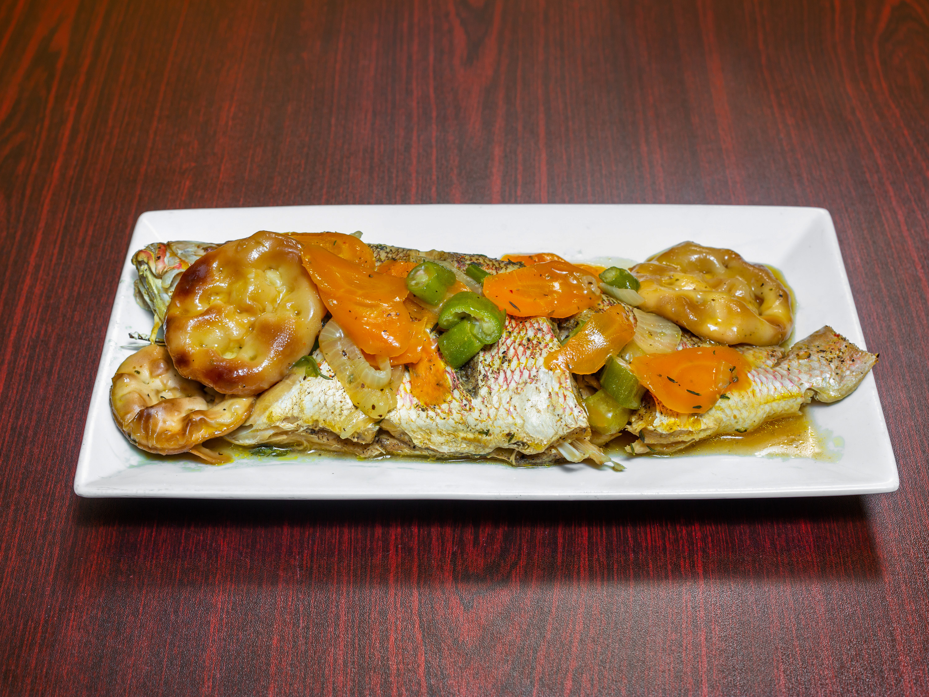 Order Steamed Snapper Fish food online from Malakhi Lounge & Jamaican Restaurant store, Manassas on bringmethat.com