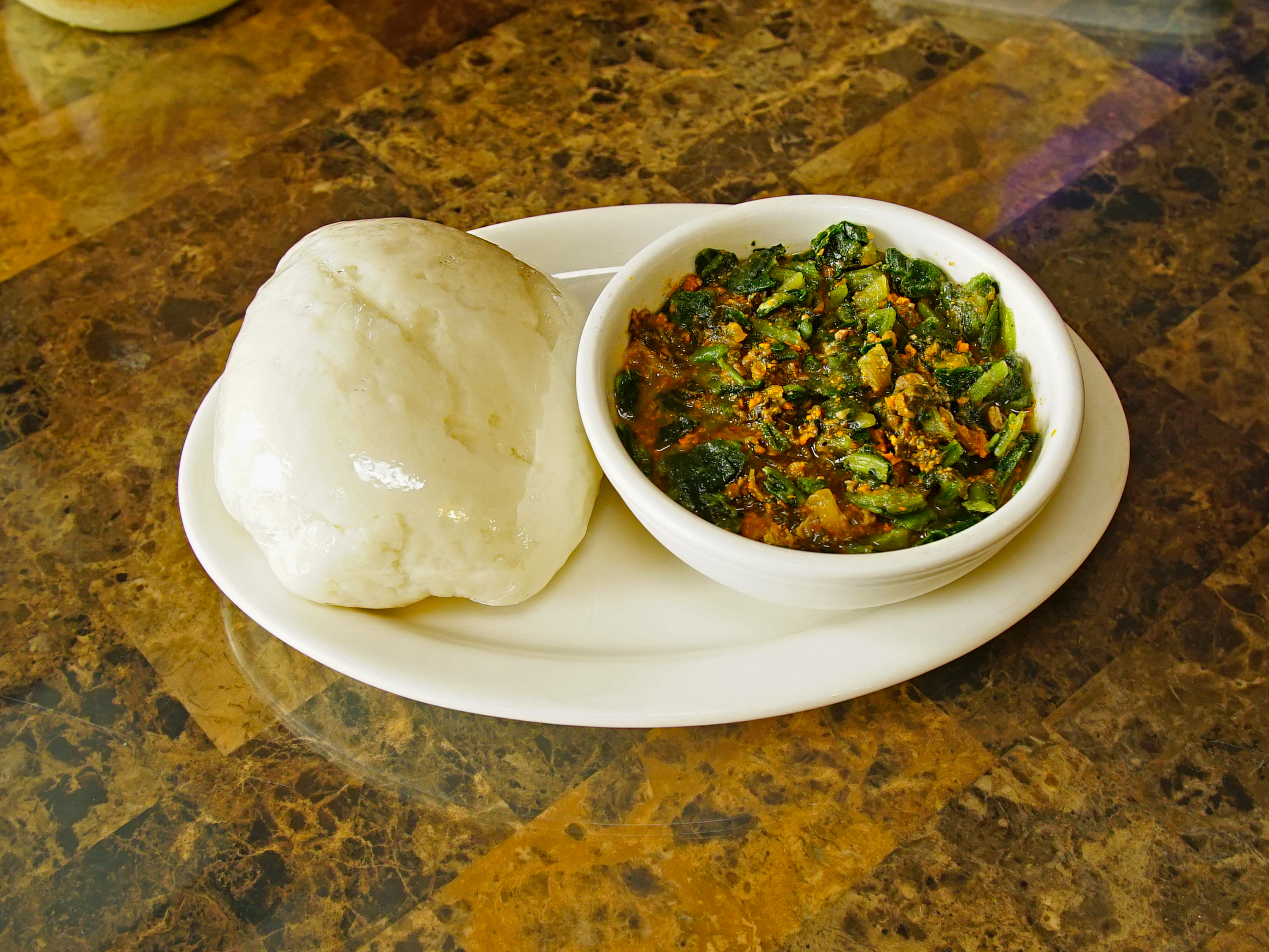 Order African Yam Fufu with Spinach Soup food online from Totos’ African Cuisine store, Van Nuys on bringmethat.com