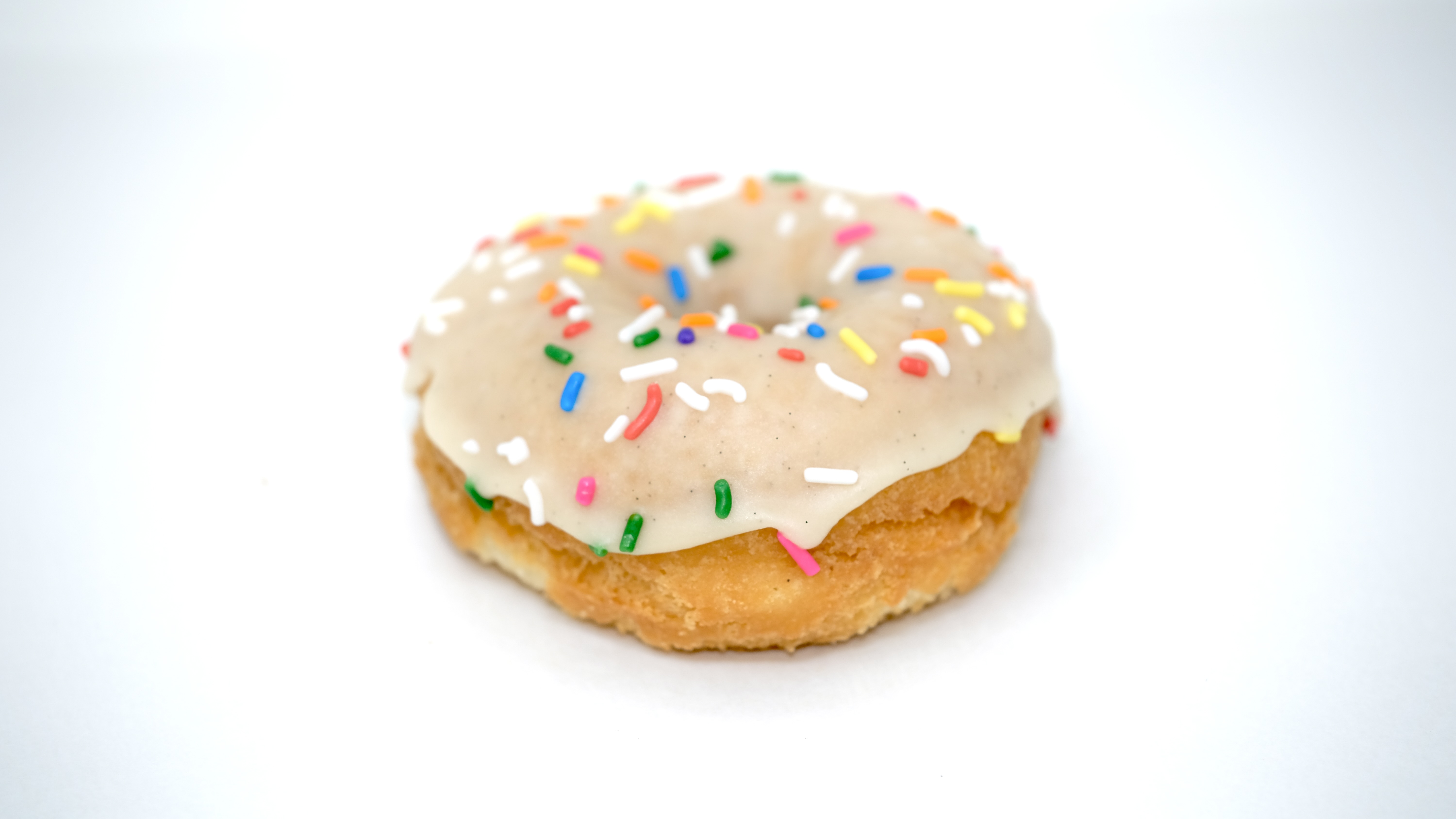 Order Rites of Sprinkles (Vanilla Glaze) food online from Donut Friend store, Los Angeles on bringmethat.com
