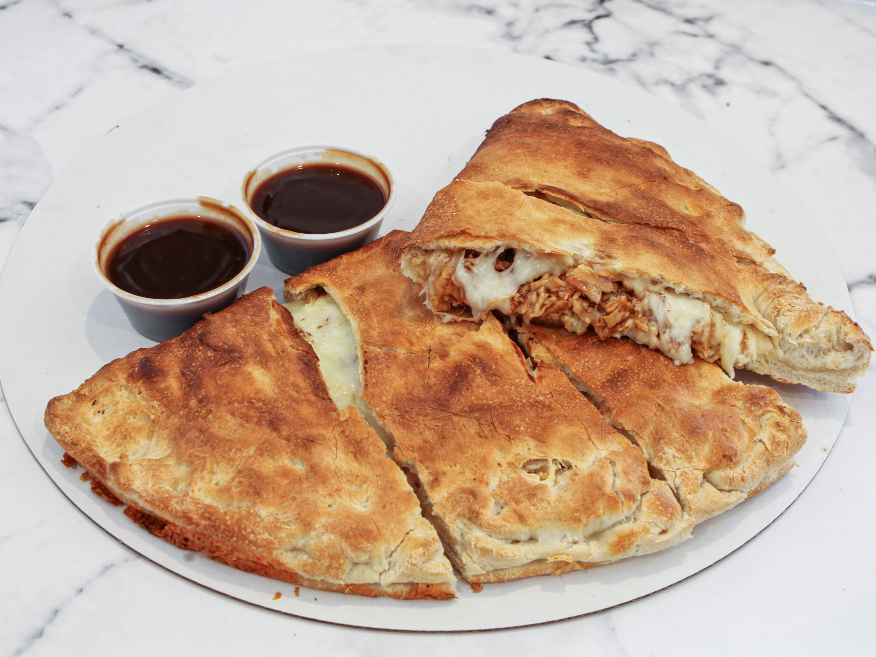 Order BBQ Chicken and Bacon Calzone food online from Yovanis Pizzeria store, Cumberland on bringmethat.com