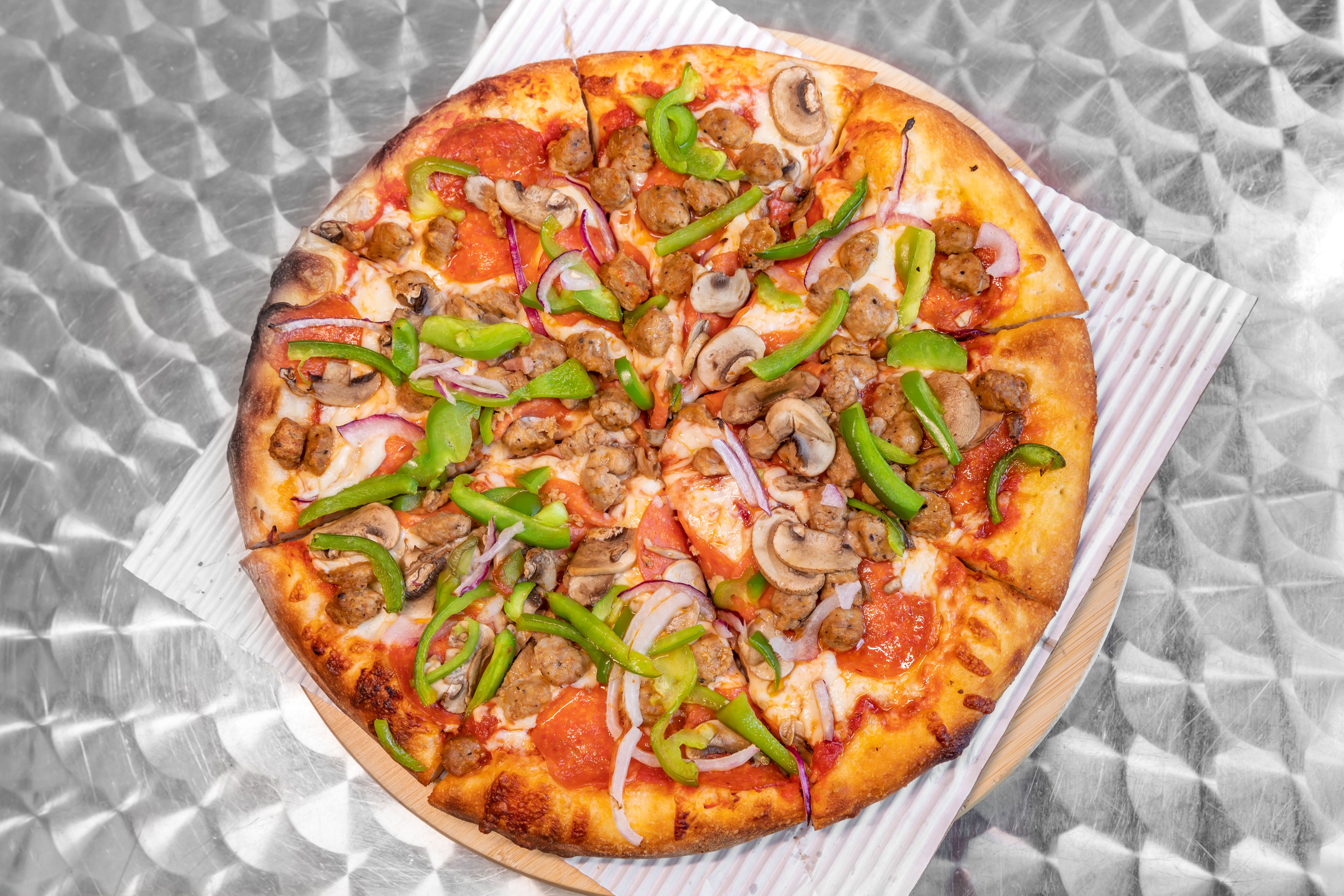 Order Supreme Pizza - Medium 12" food online from Promenade Pizza store, Anaheim on bringmethat.com
