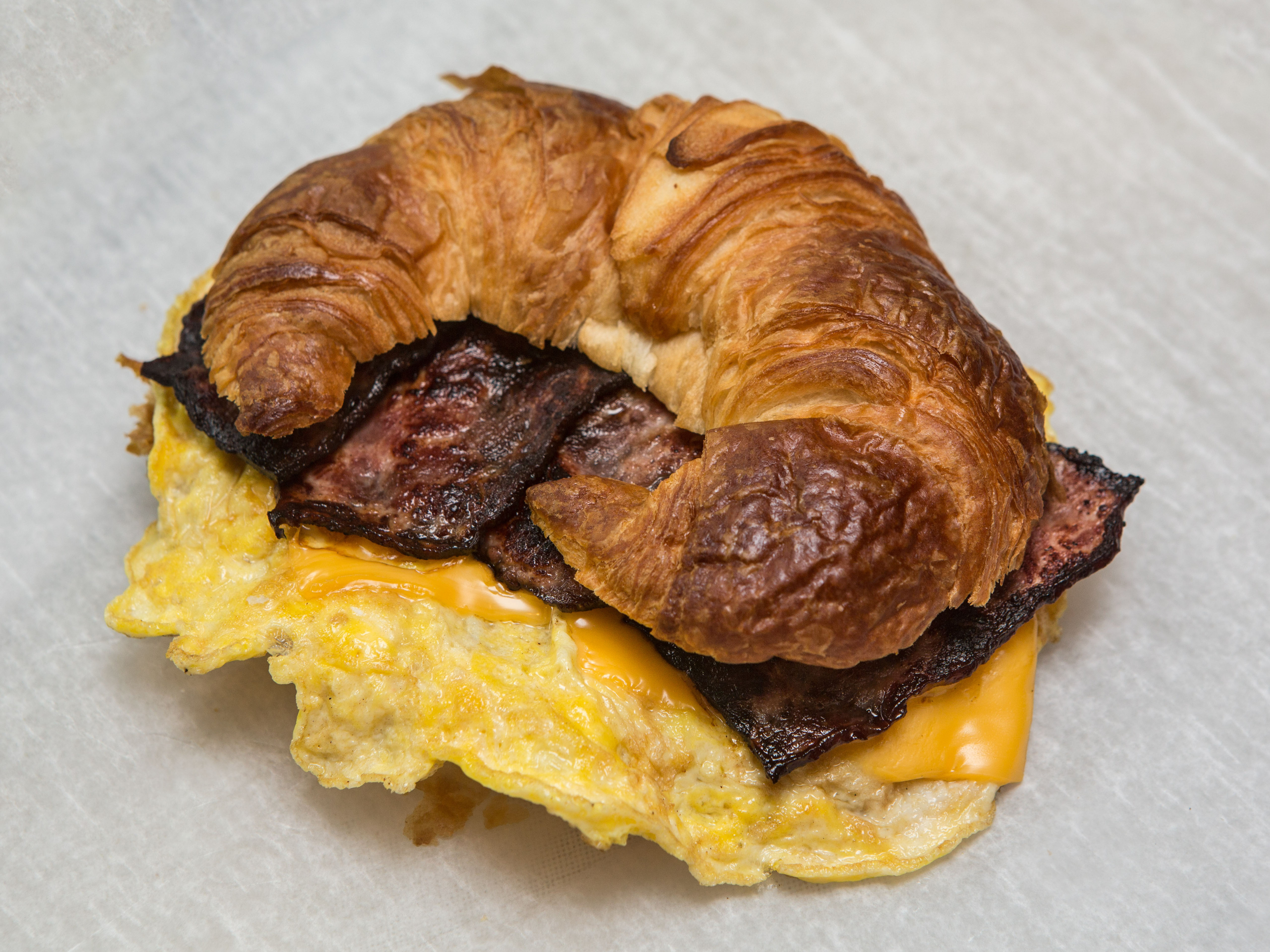 Order B.11 Croissant bacon egg and cheese food online from Natural Plus store, Brooklyn on bringmethat.com