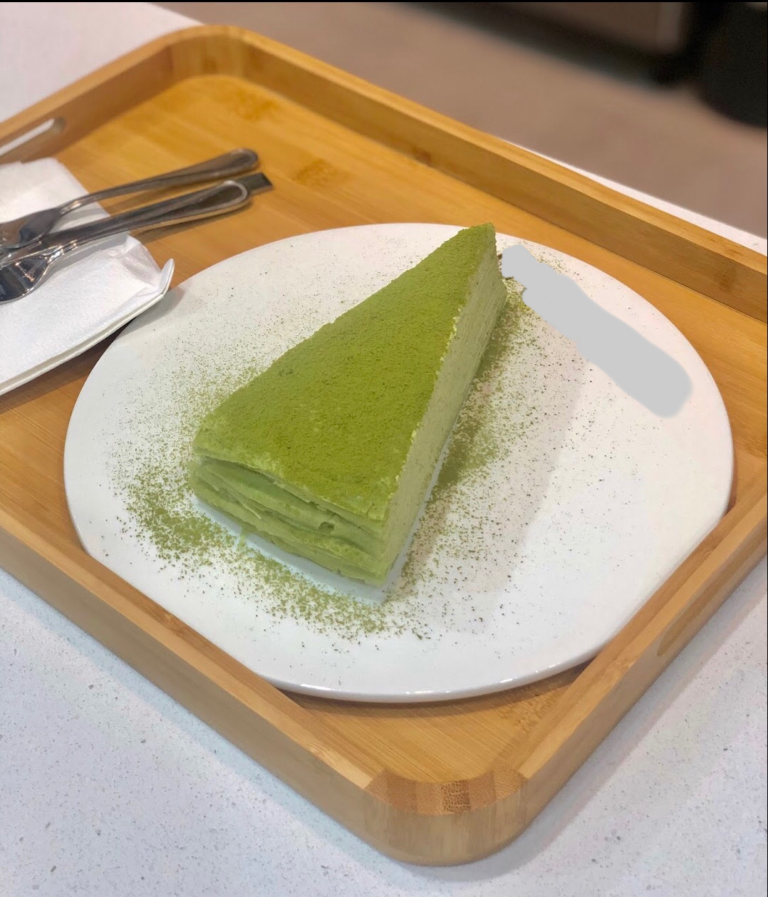 Order S10. Green Tea Mille Crepe Cake food online from Mango Mango Dessert store, Denver on bringmethat.com