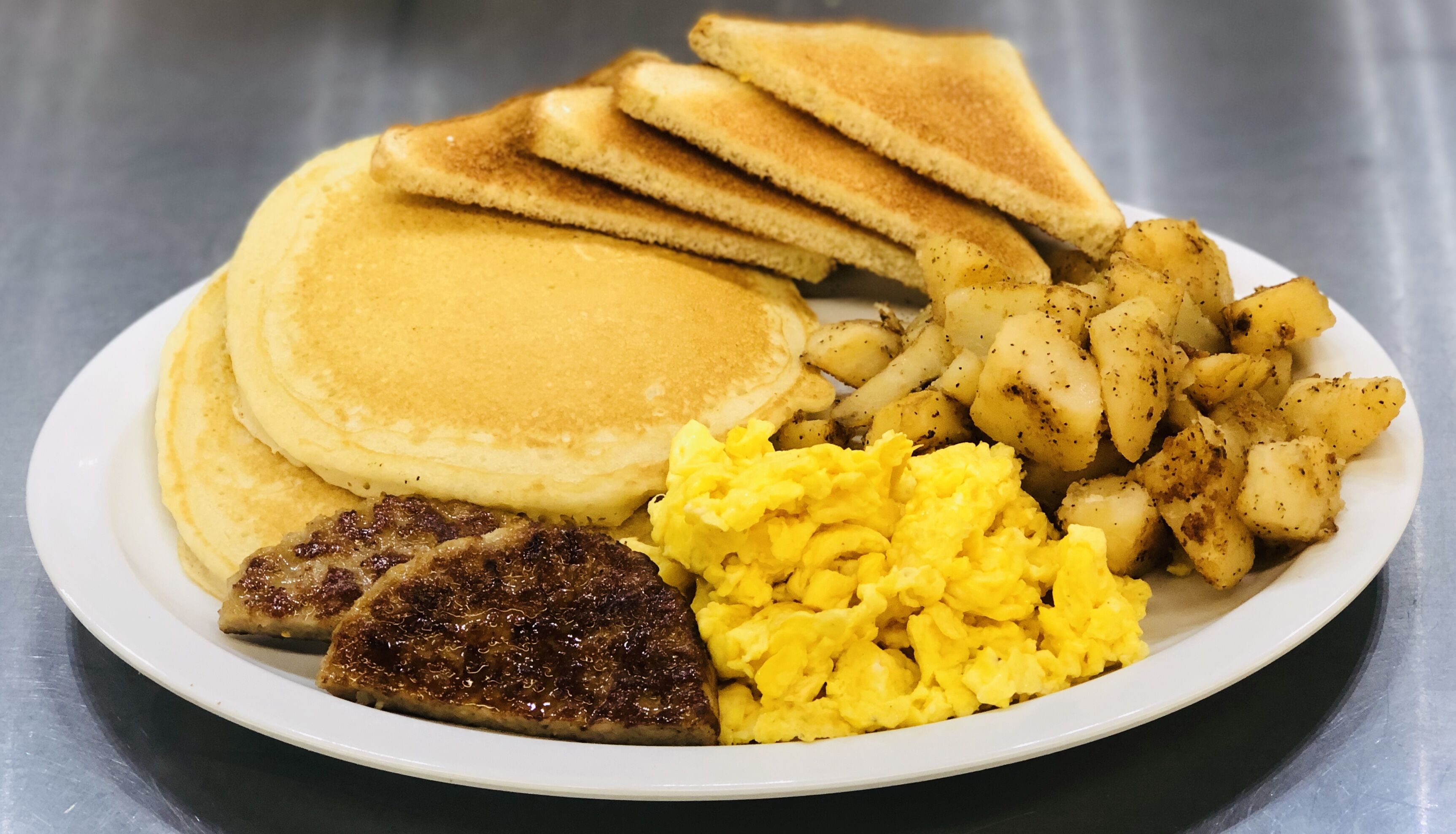 Order #2 Two Pancakes, Eggs, and Breakfast Meat food online from 270 Deli NY store, Hempstead on bringmethat.com