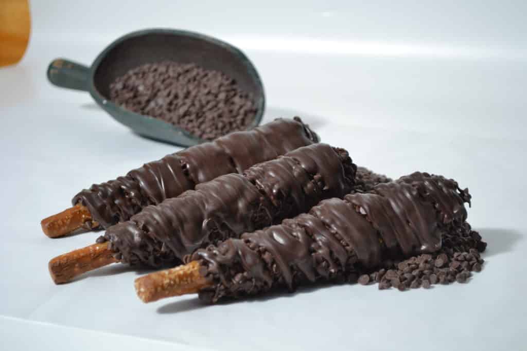 Order Caramel, Dark Chocolate Chips & Dark Chocolate Pretzel Rod food online from Candy Apple Shoppe store, Glenwood on bringmethat.com