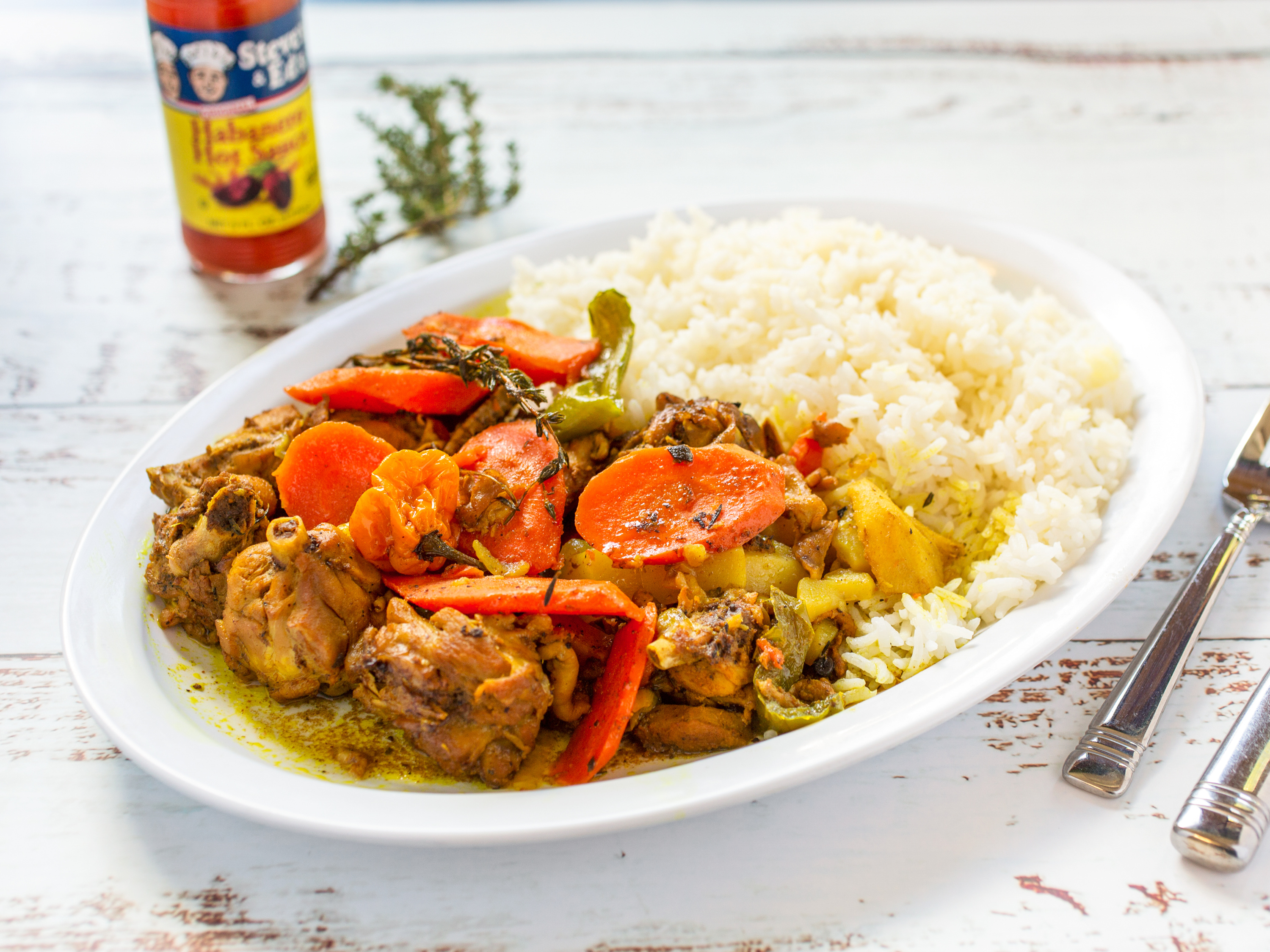 Order Curry Chicken food online from Island Buzz store, Rochester on bringmethat.com