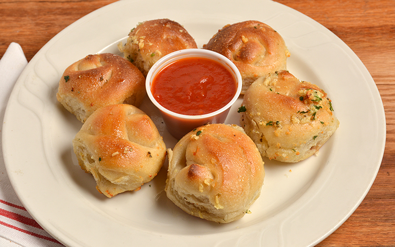 Order 6 Garlic Knots food online from Cinelli's Pizza store, Franklin Square on bringmethat.com