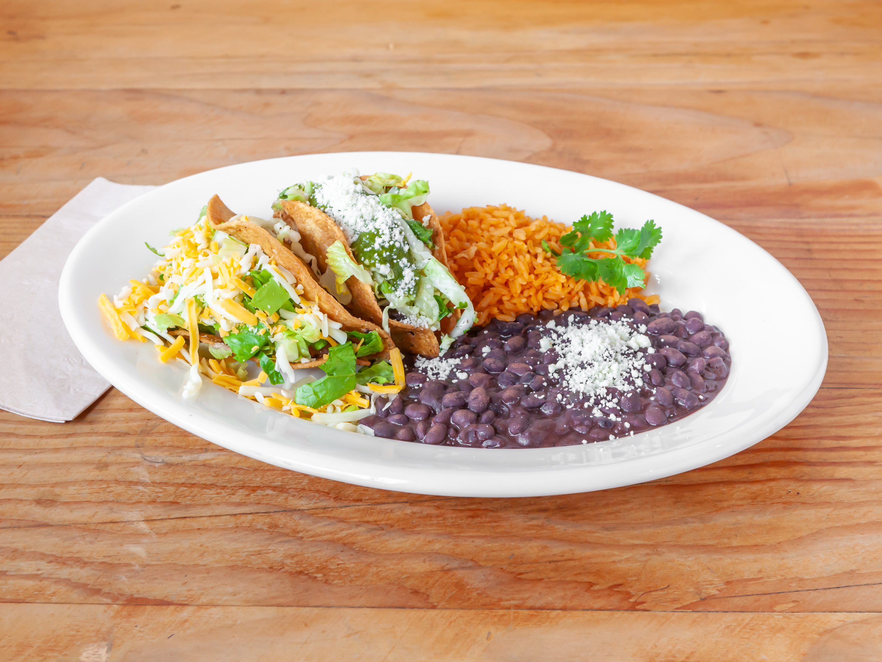 Order Oaxacan Enchilada and Crispy Black Bean Taco food online from Kayndaves store, Pacific Palisades on bringmethat.com