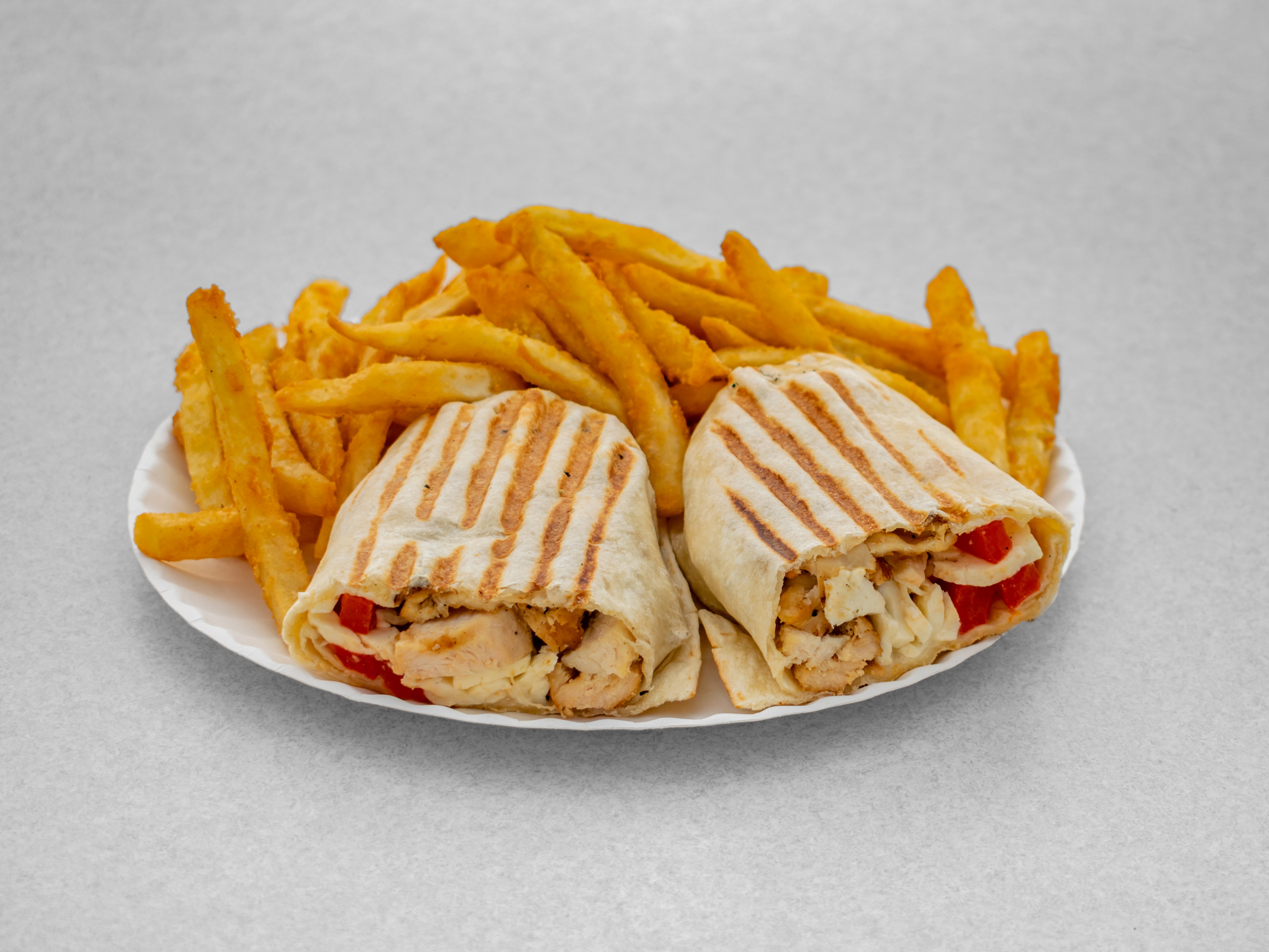 Order 1. Grilled Chicken Wrap food online from Pizza & Sandwich Express store, Little Falls on bringmethat.com