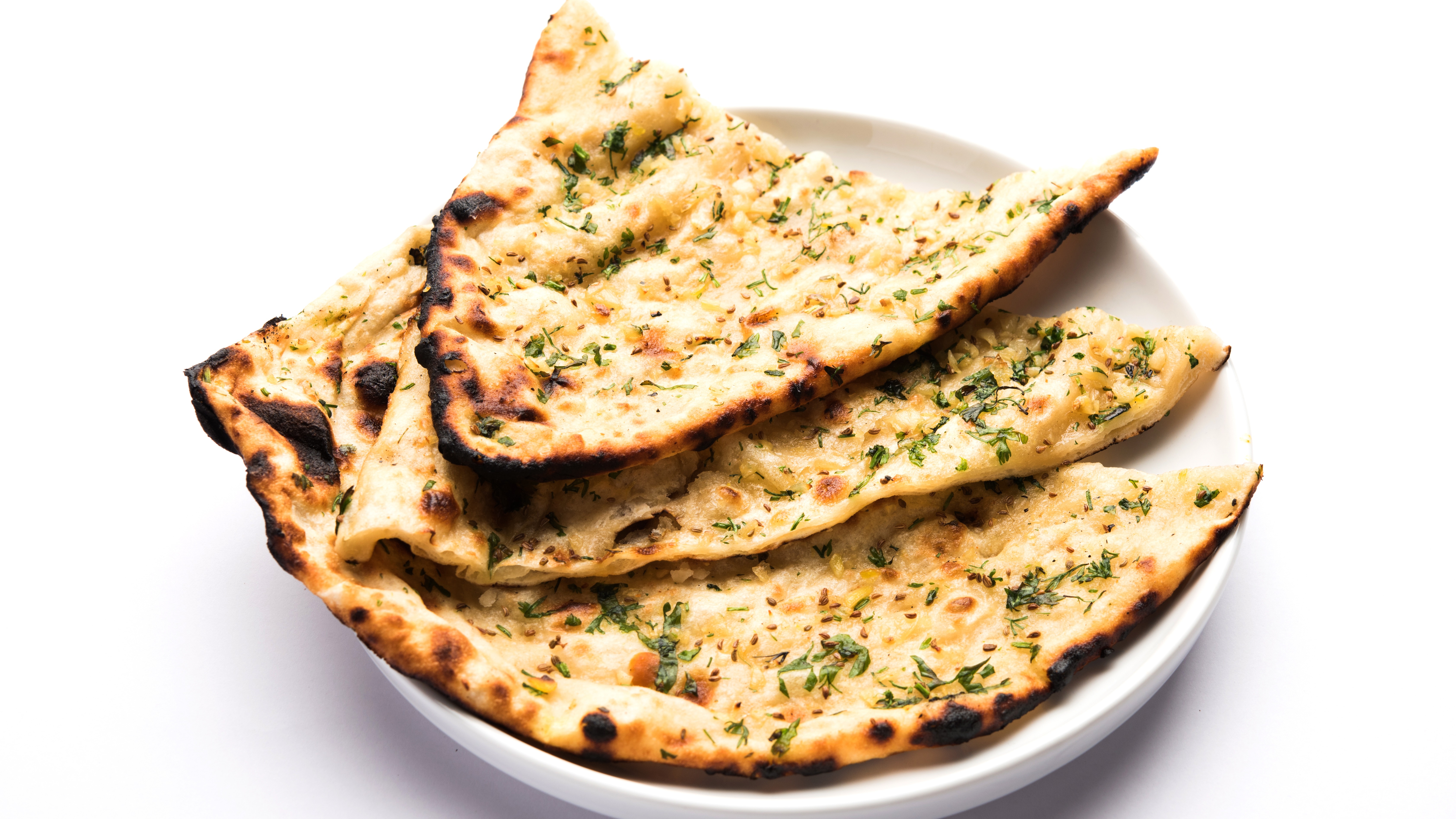 Order Garlic Naan food online from Tikka Cravings store, Patchogue on bringmethat.com