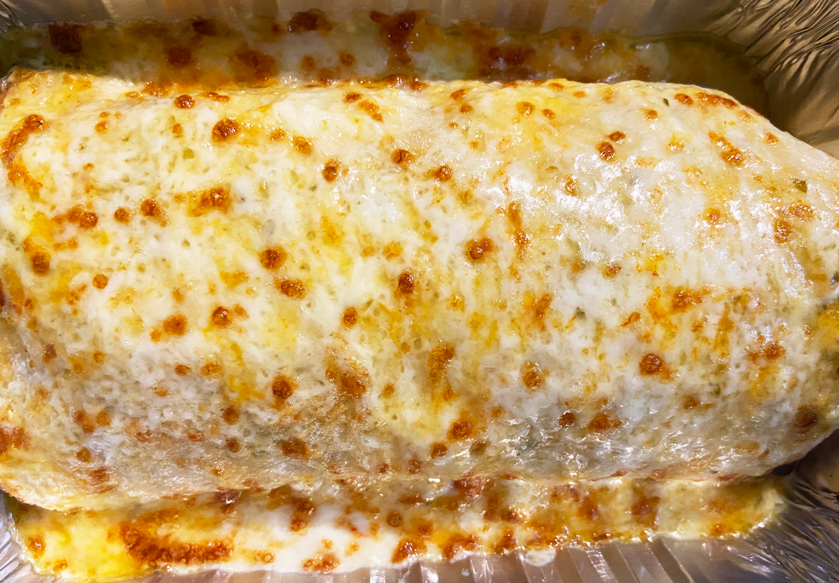 Order Burrito Suizo Solo "The Big Cheesy Burrito" food online from Papacito's Mexican Grille & Catering Service store, Chicago on bringmethat.com