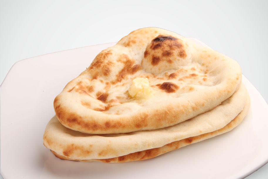 Order Naan food online from India's Grill store, Los Angeles on bringmethat.com