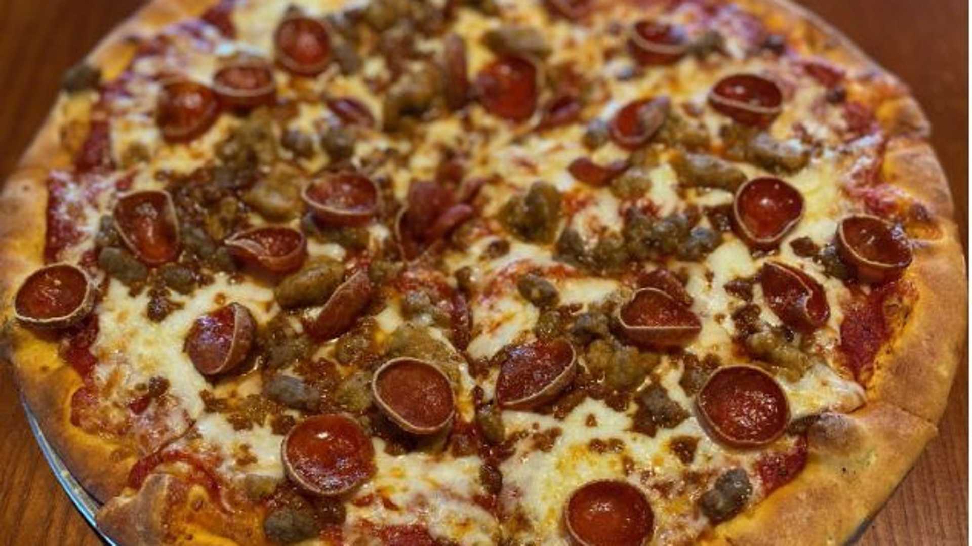 Order Carnivore Pizza food online from Kickback Jack's store, Fayetteville on bringmethat.com