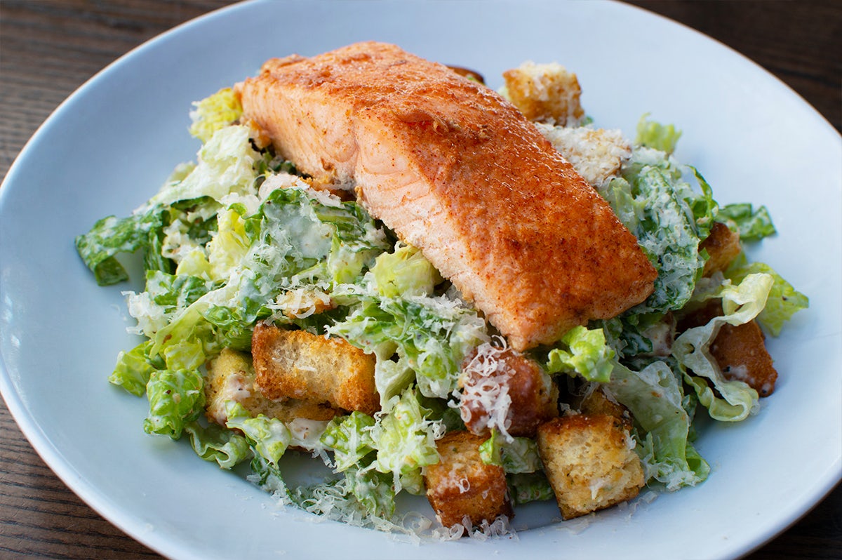 Order Charlotte's Salmon Caesar Salad food online from Bad Daddy's Burger Bar store, Raleigh on bringmethat.com